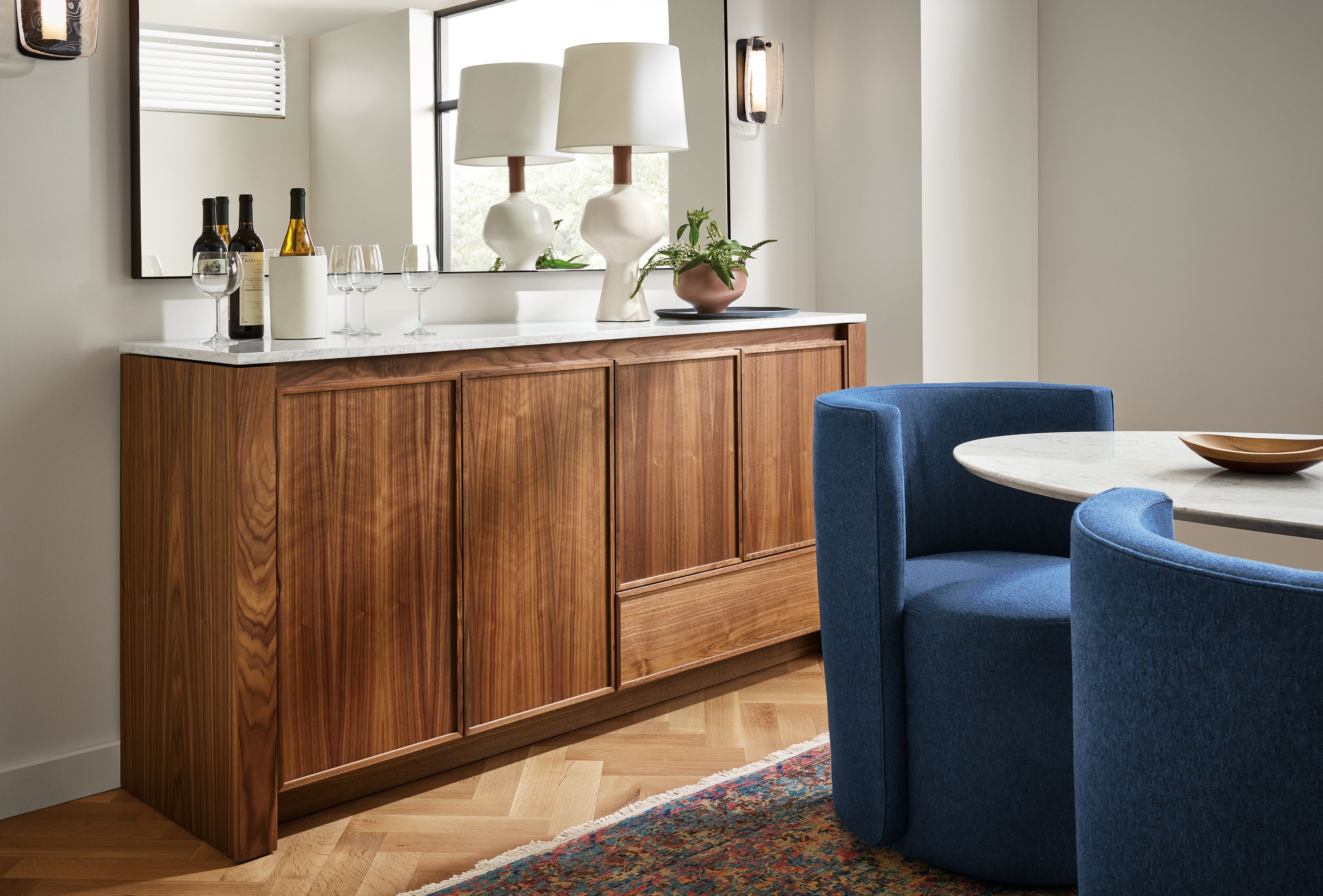Dining room with Amherst 72-wide Storage Cabinet in walnut with Infinity 70-wide mirror in graphite.