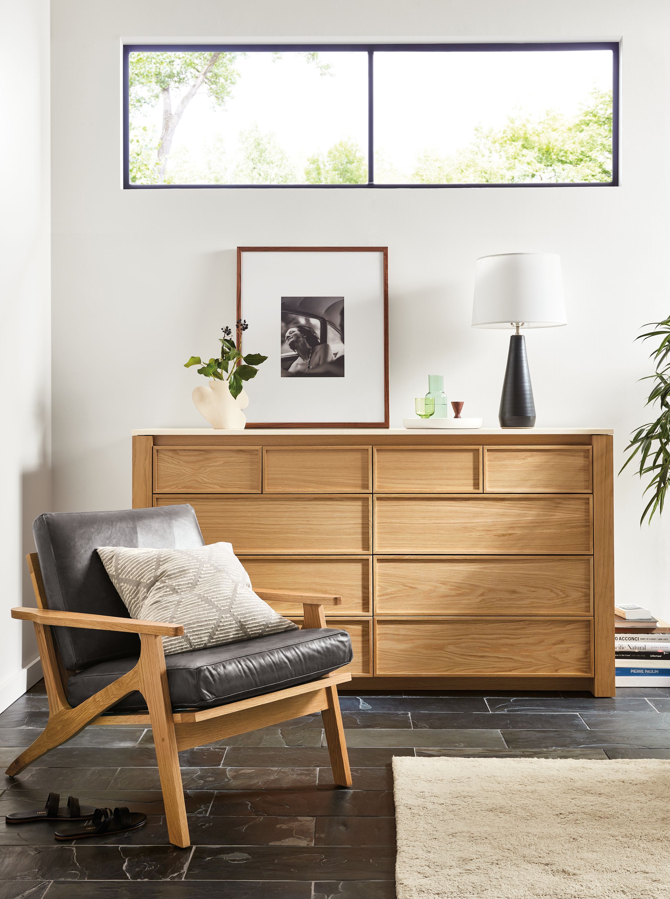 amherst 72-wide 10-drawer dresser in white oak next to sanna chair.