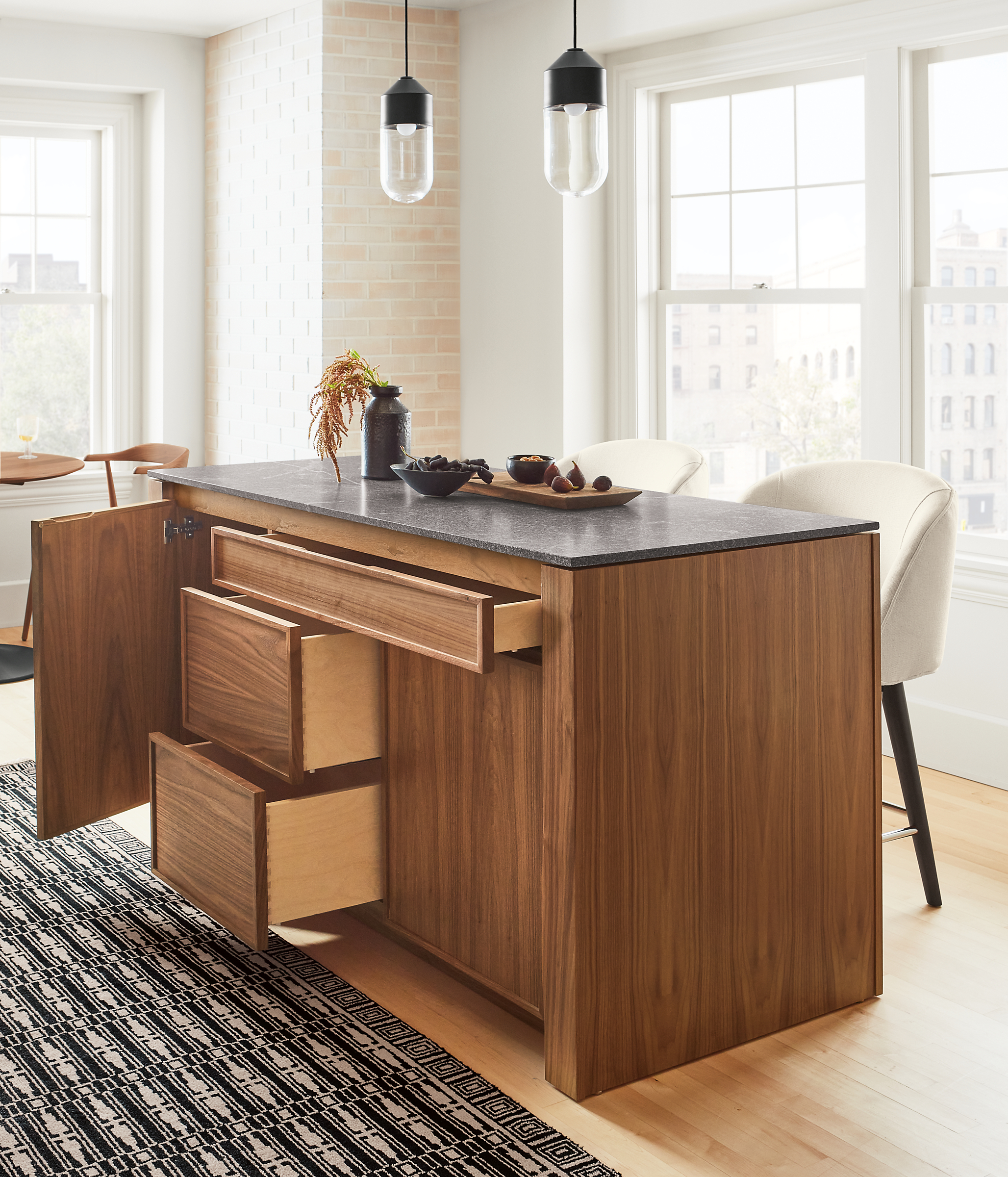 Detail of Amherst 60-wide Kitchen Island in walnut with doors and drawers open.