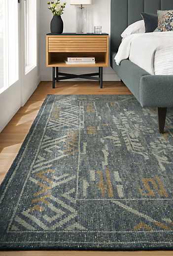 Detail of Amira rug in ocean in bedroom with Harley bed and Adrian nightstand.