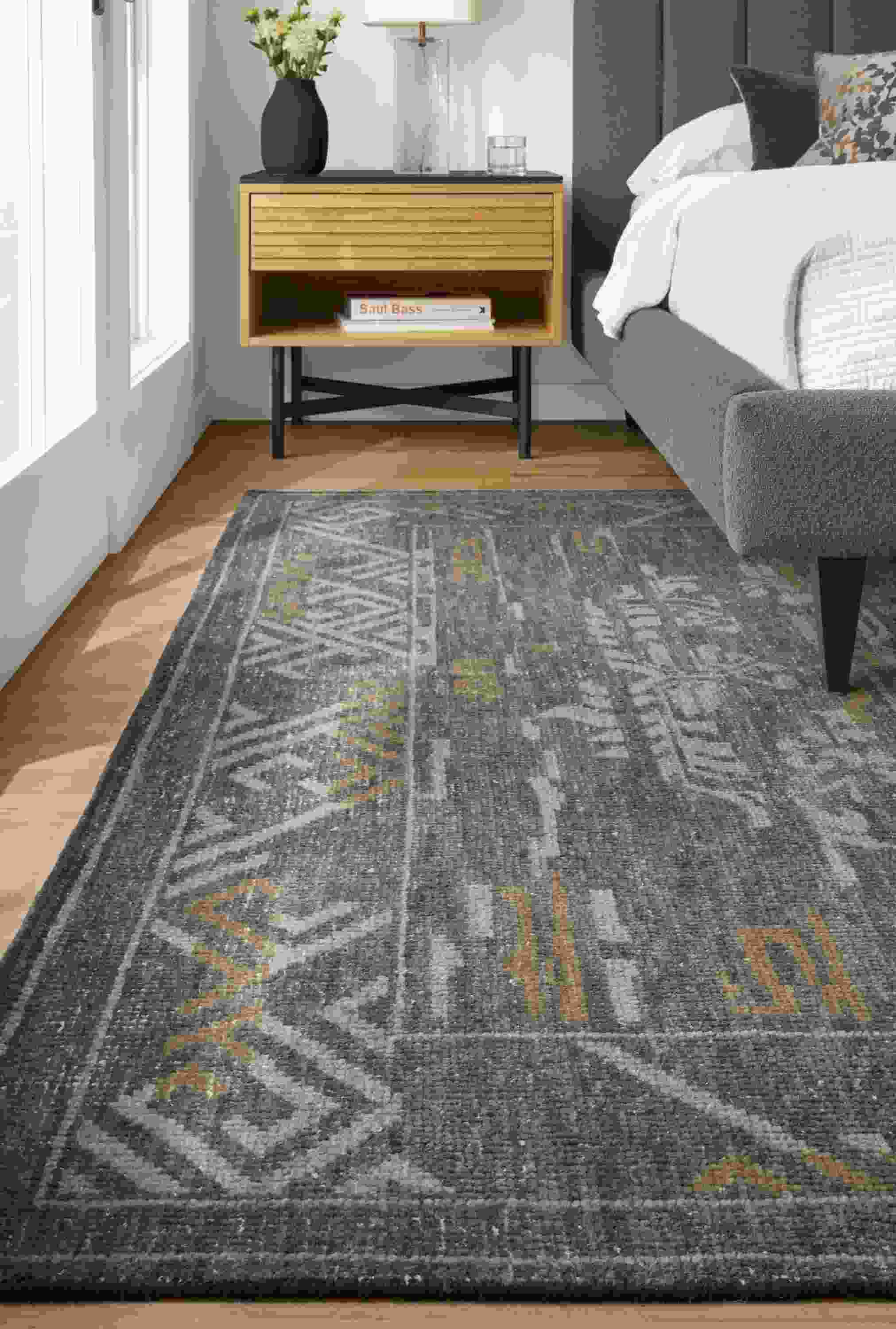 Detail of Amira rug in ocean in bedroom with Harley bed and Adrian nightstand.