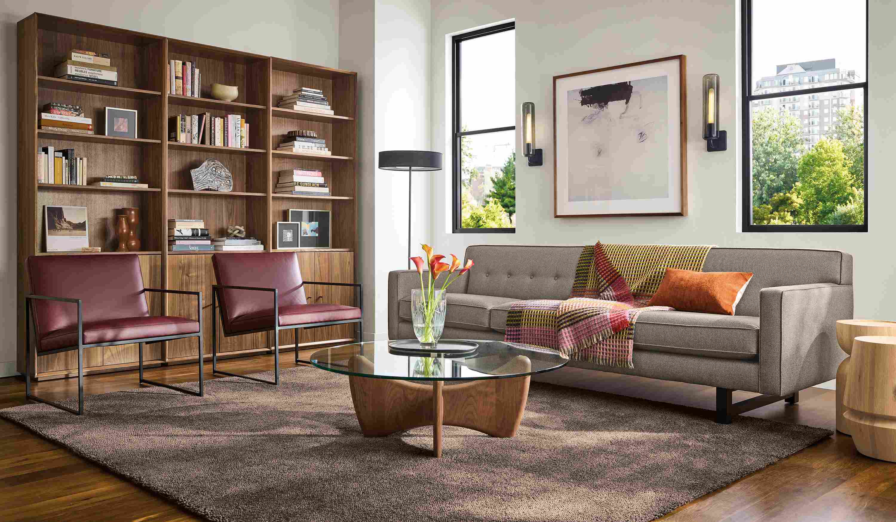 Living room with Andre 101-wide sofa in Derry Charcoal and 2 Novato chairs in Pesaro Merlot leather.