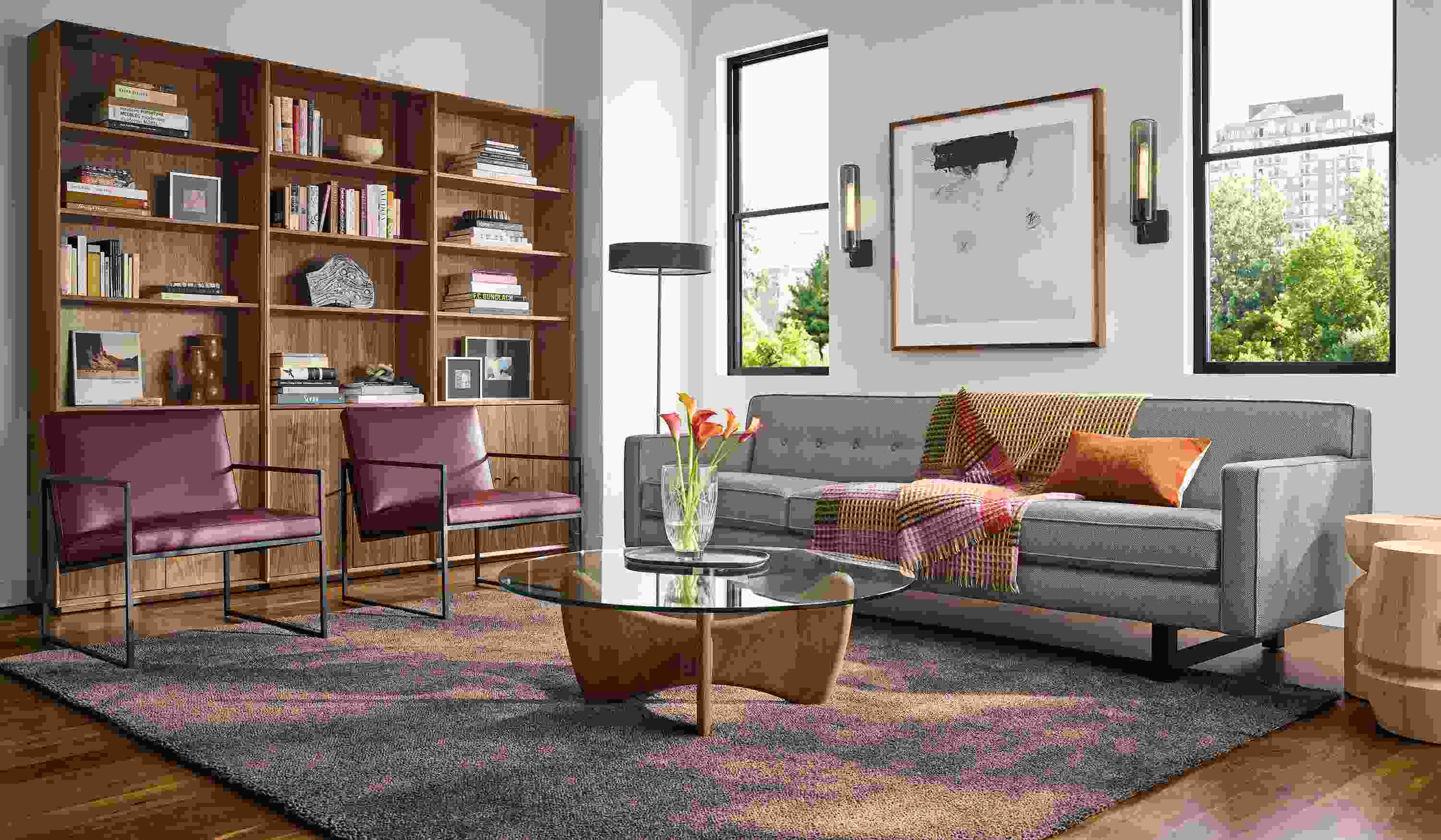 Living room with Andre 101-wide sofa in Derry Charcoal and 2 Novato chairs in Pesaro Merlot leather.