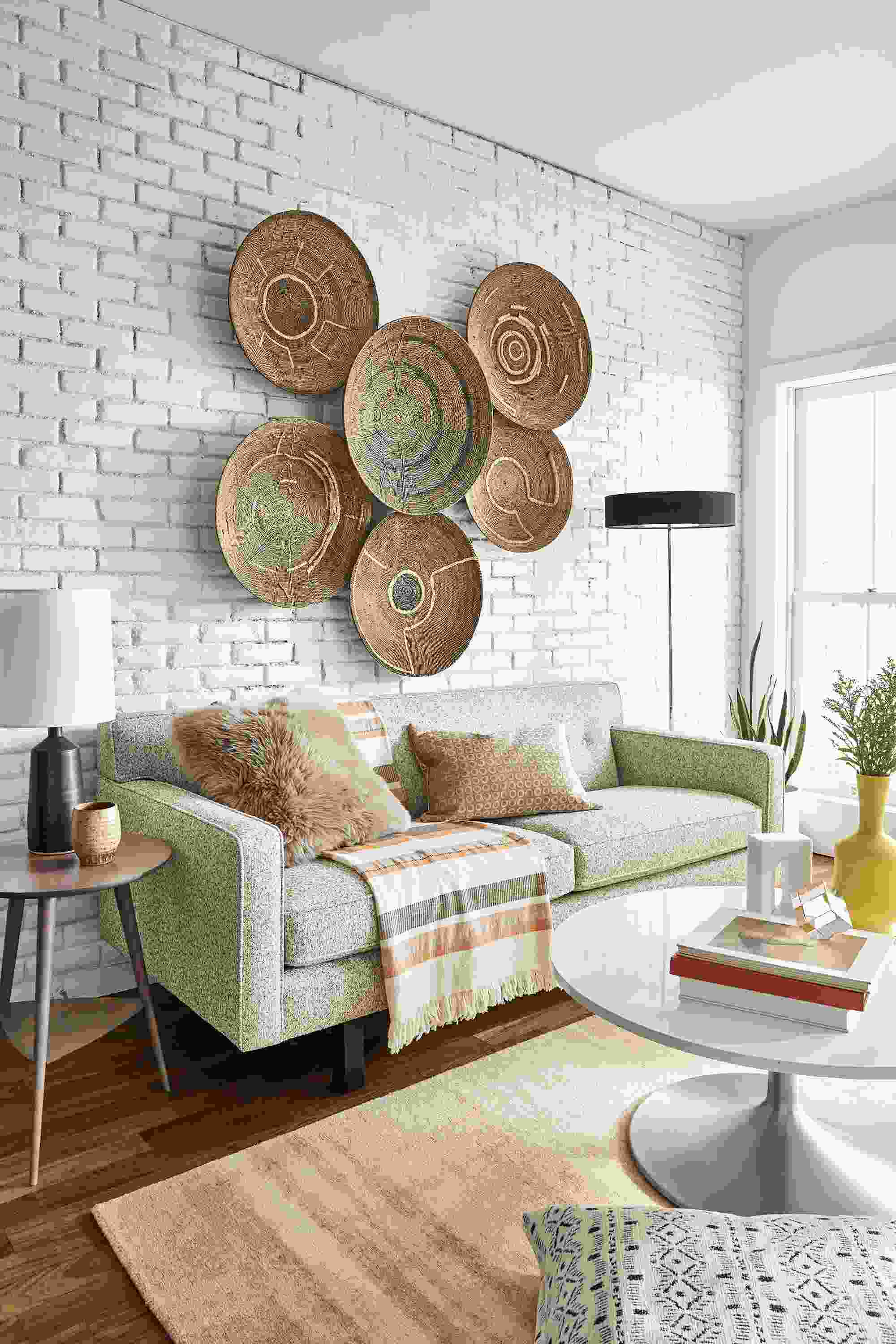Andre 76-wide Sofa in Conley Oatmeal with various African Makenge baskets above.