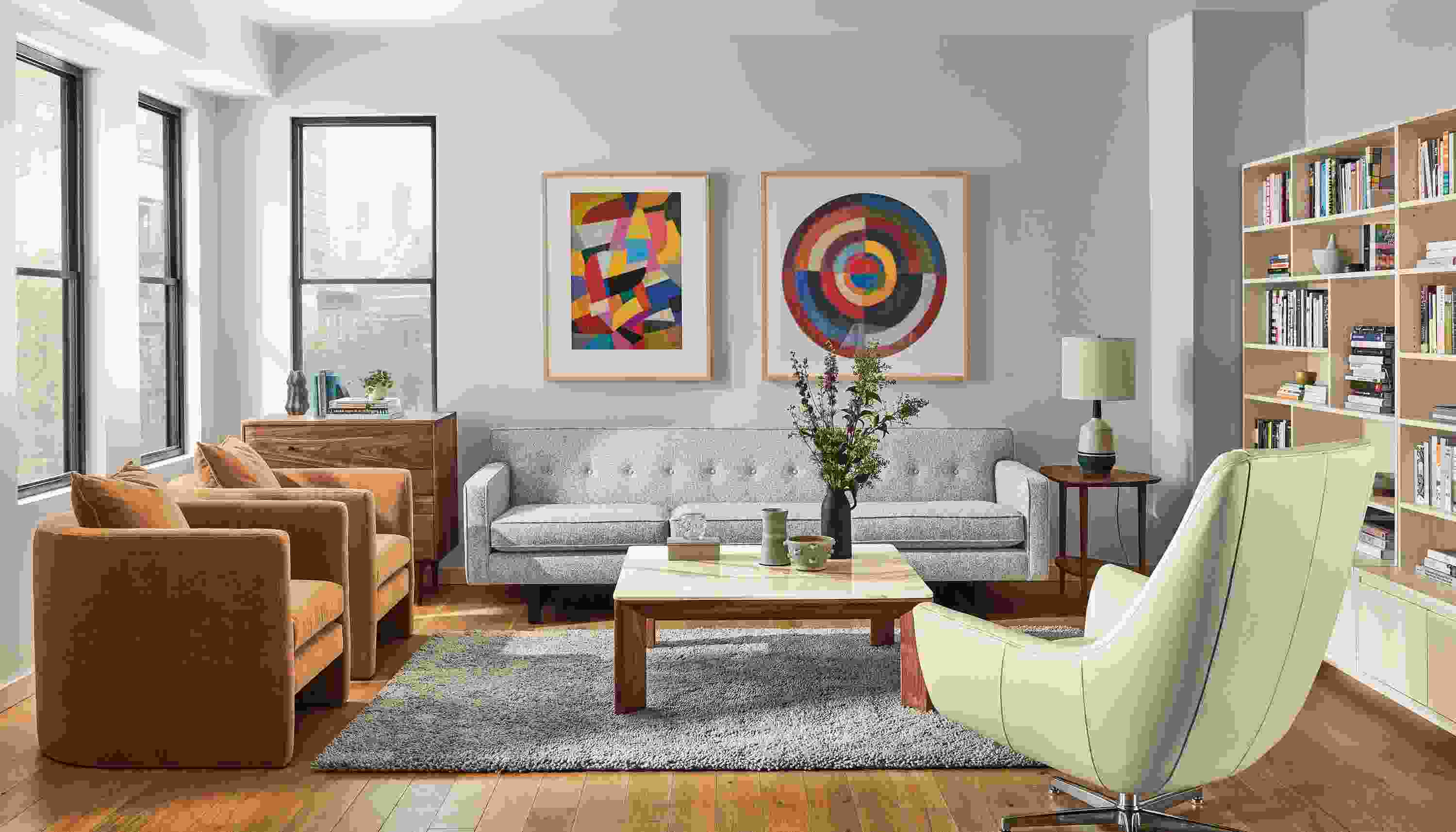 Andre Sofa in Conley Oatmeal with two Silva Chair in Banks Cognac and Charles Swivel Chair.
