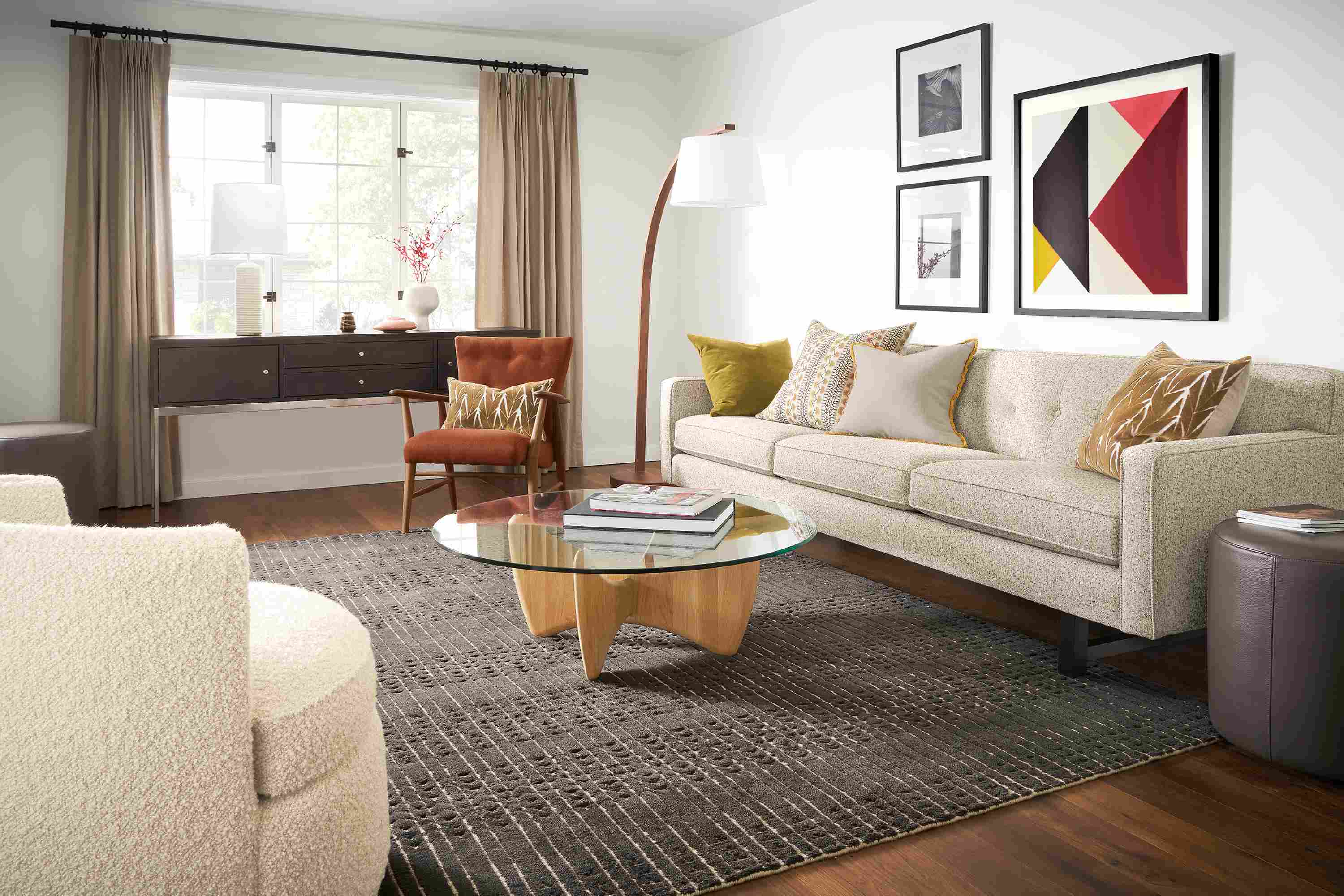 living room with andre sofa in white fabric, sanders coffee table, bria rug, jonas chair.