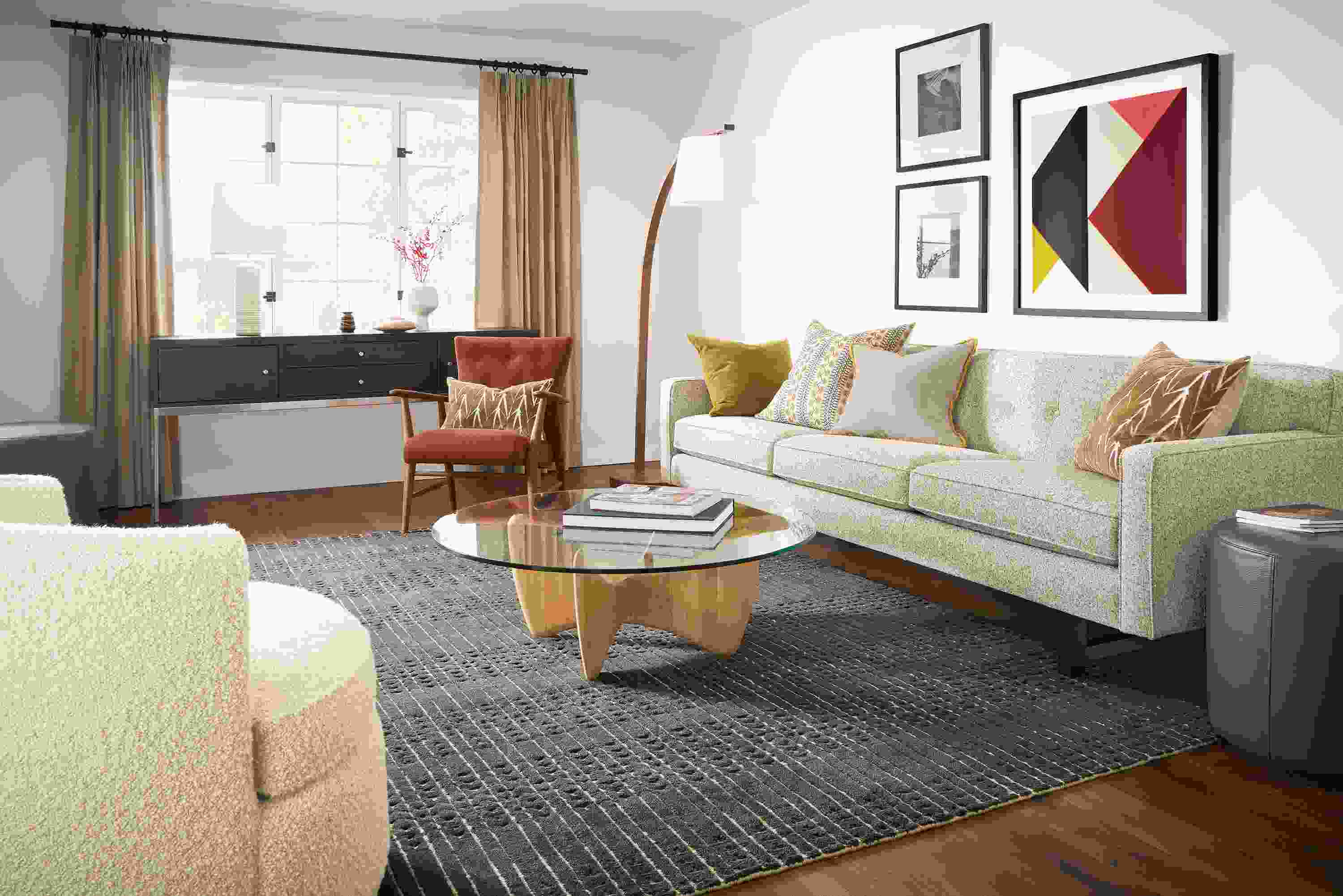 living room with andre sofa in white fabric, sanders coffee table, bria rug, jonas chair.