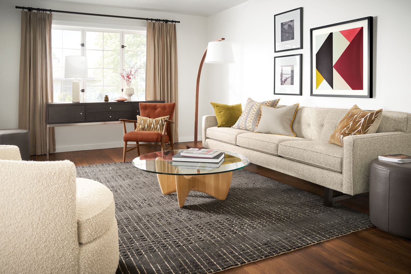 living room with andre sofa in white fabric, sanders coffee table, bria rug, jonas chair.