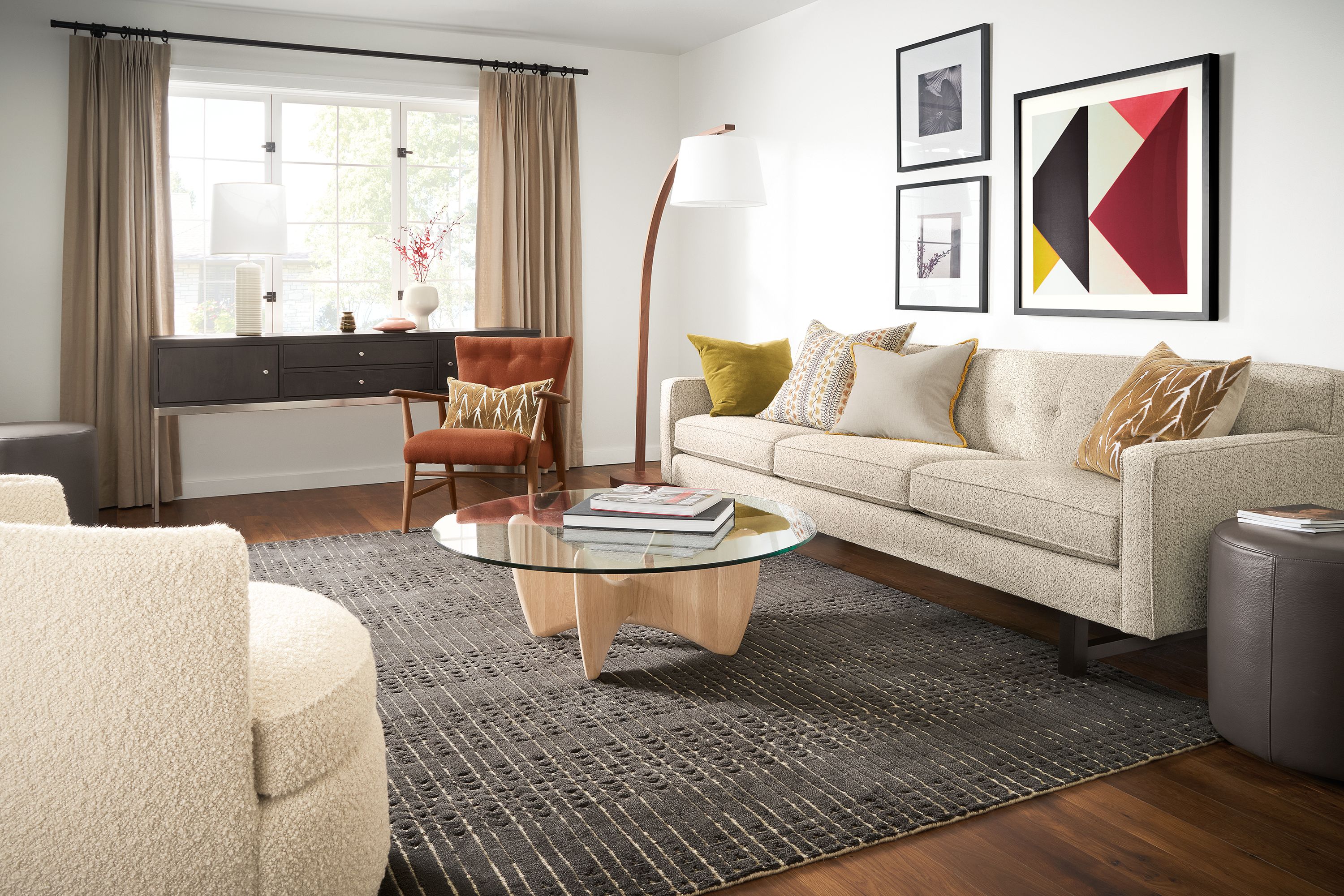living room with andre sofa in white fabric, sanders coffee table in salt, bria rug, jonas chair.