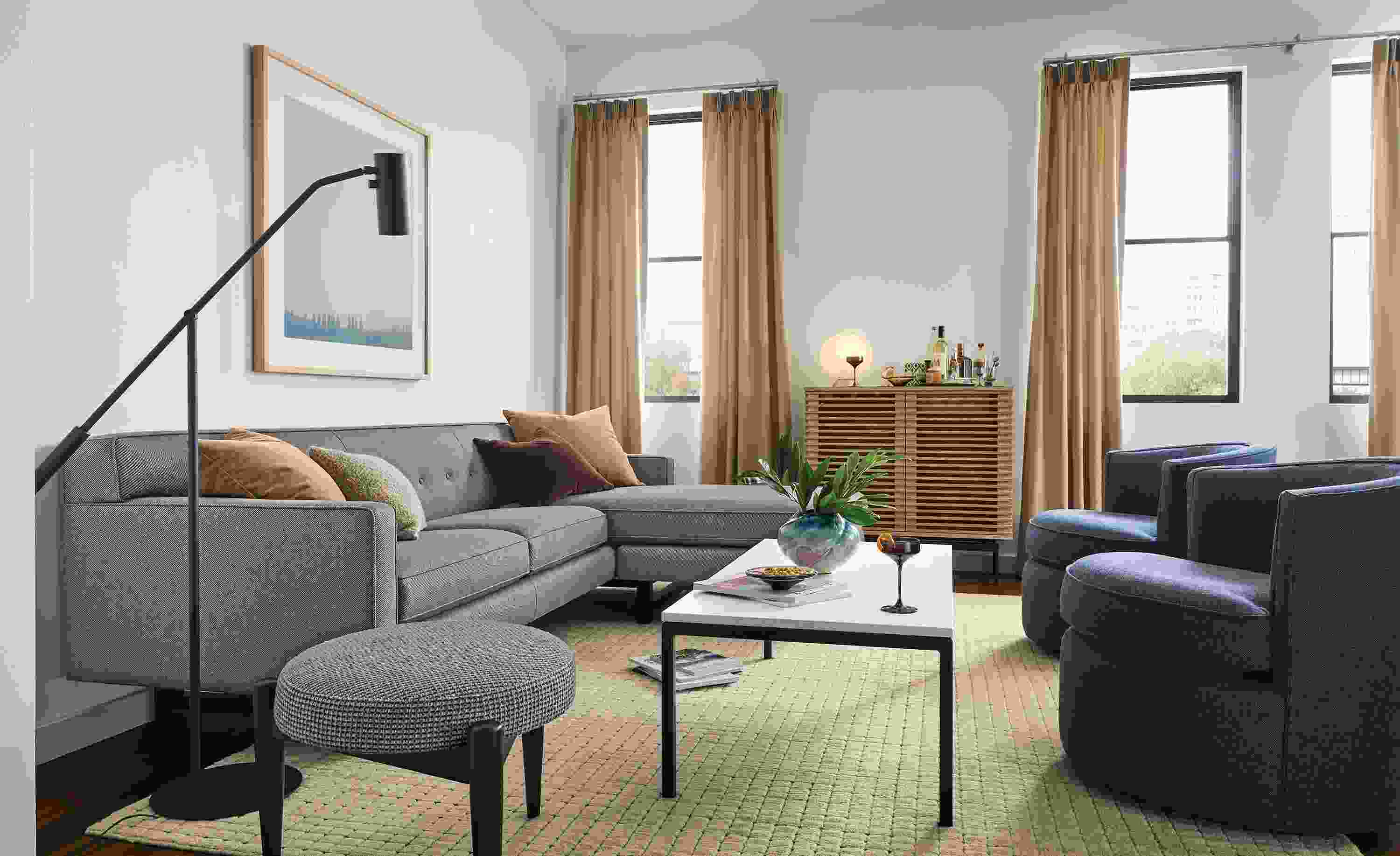 Living room with 101-wide Andre sofa in Derry Charcoal and 2 Otis swivel chairs in Sumner Navy.