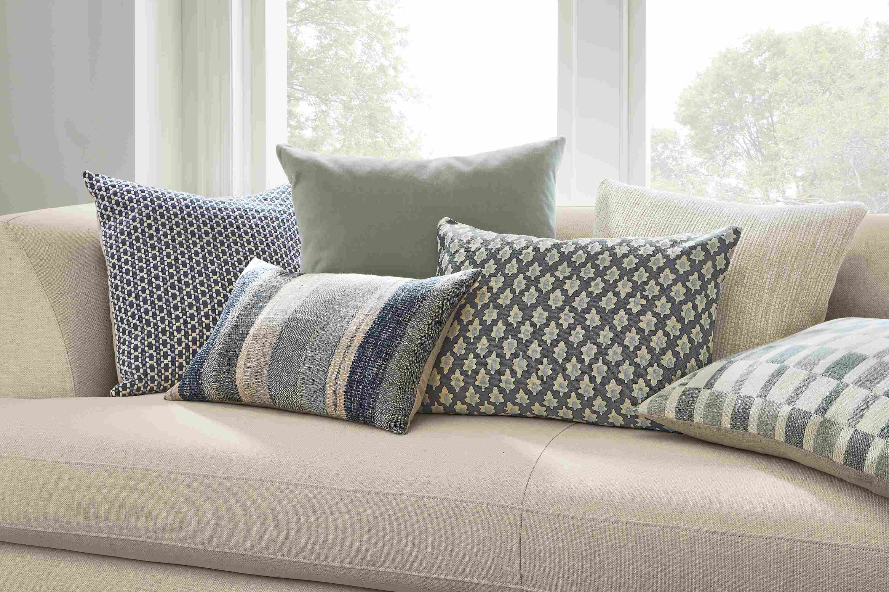 Ansley, Tetra, Mohair, Valenta, Arcade and Zeller pillows on sofa.