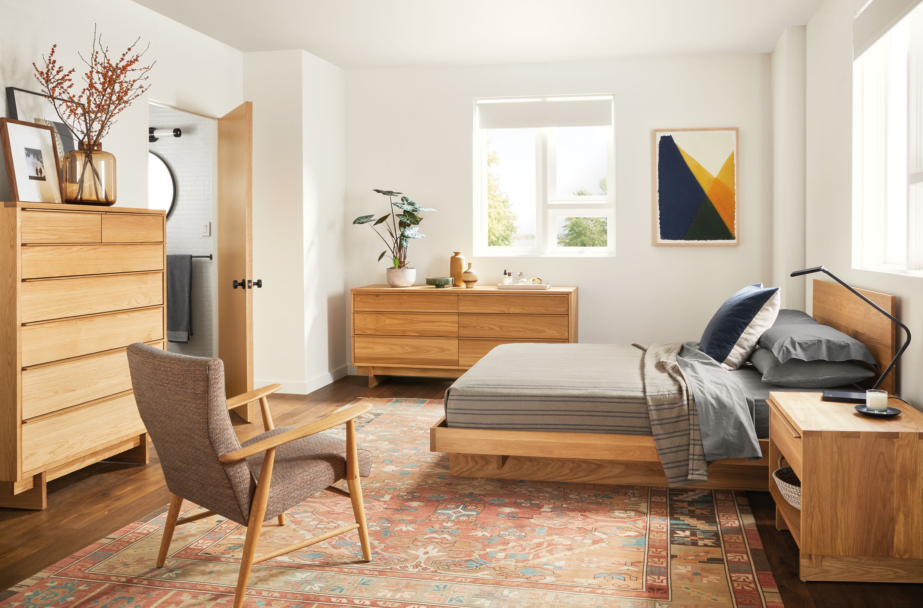 Detail of Anton queen bed in white oak in bedroom with other white oak furniture.