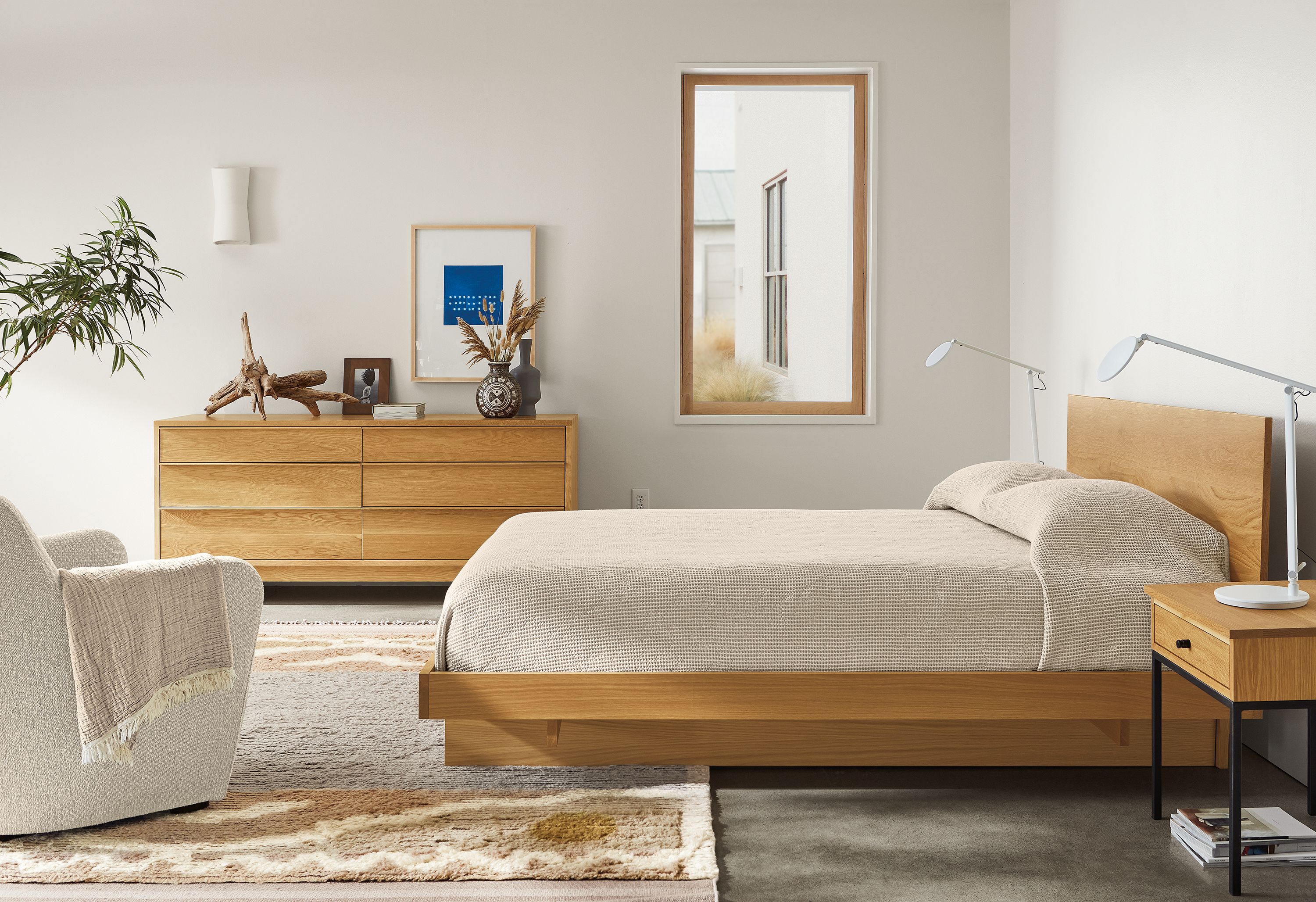 Bedroom with Anton bed and dresser in white oak, Tova rug, Lily chair.