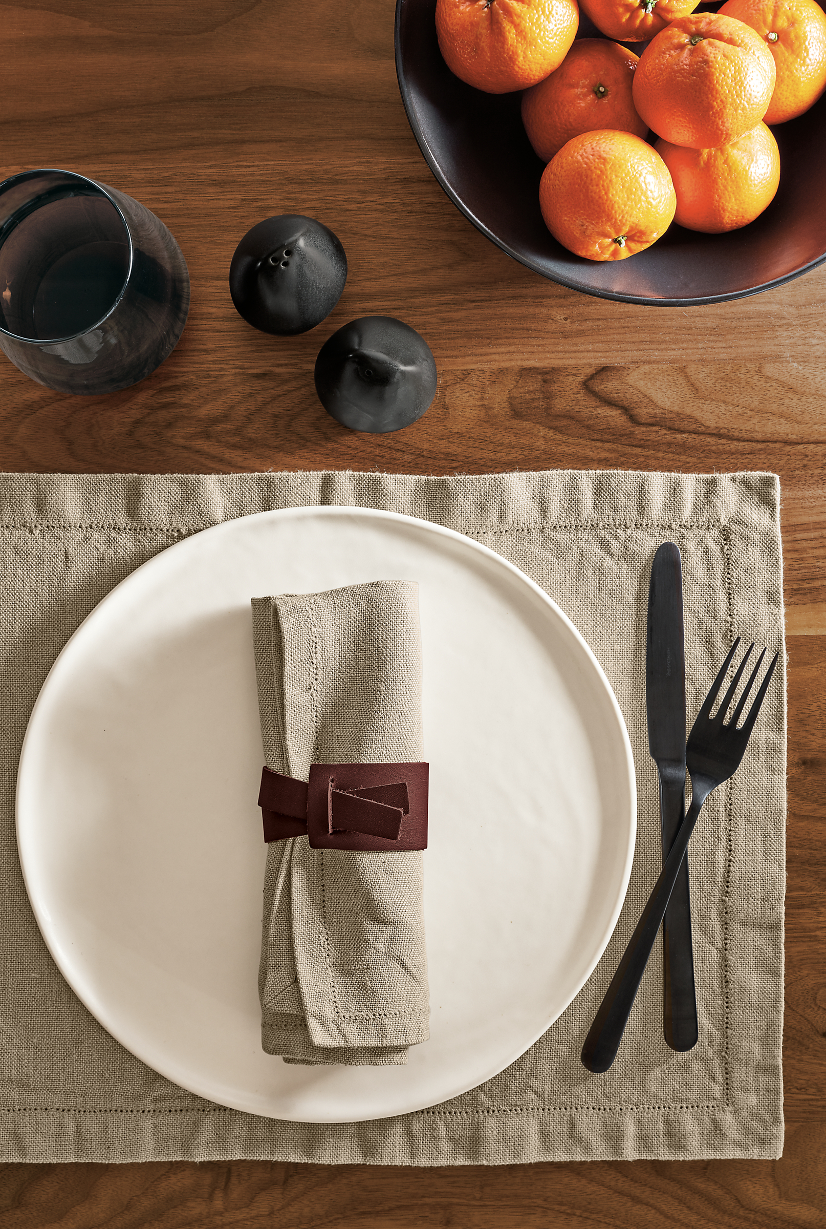 Detail of Verza leather napkin ring in place setting.