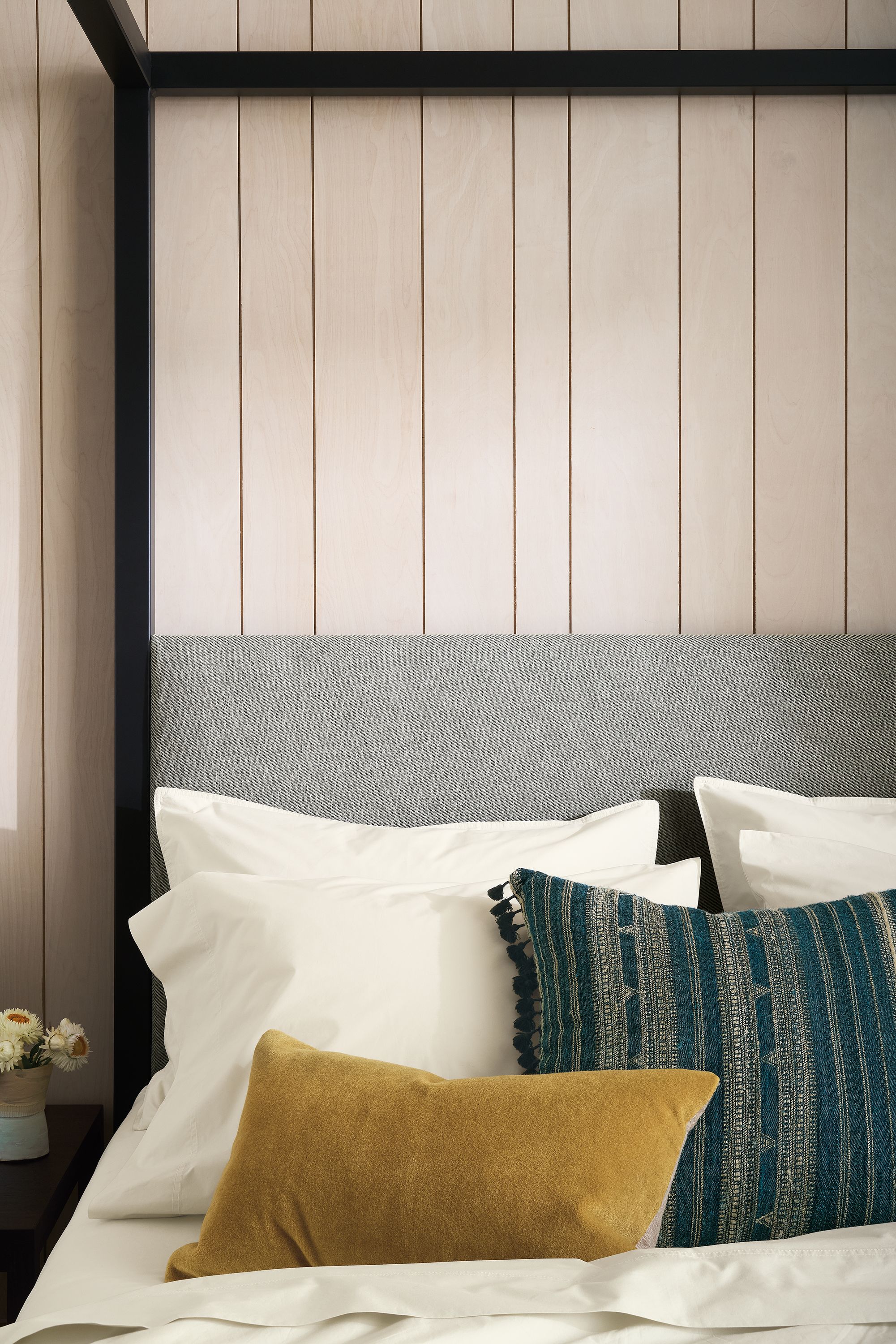 Queen bed in Derry cement fabric with natural steel frame