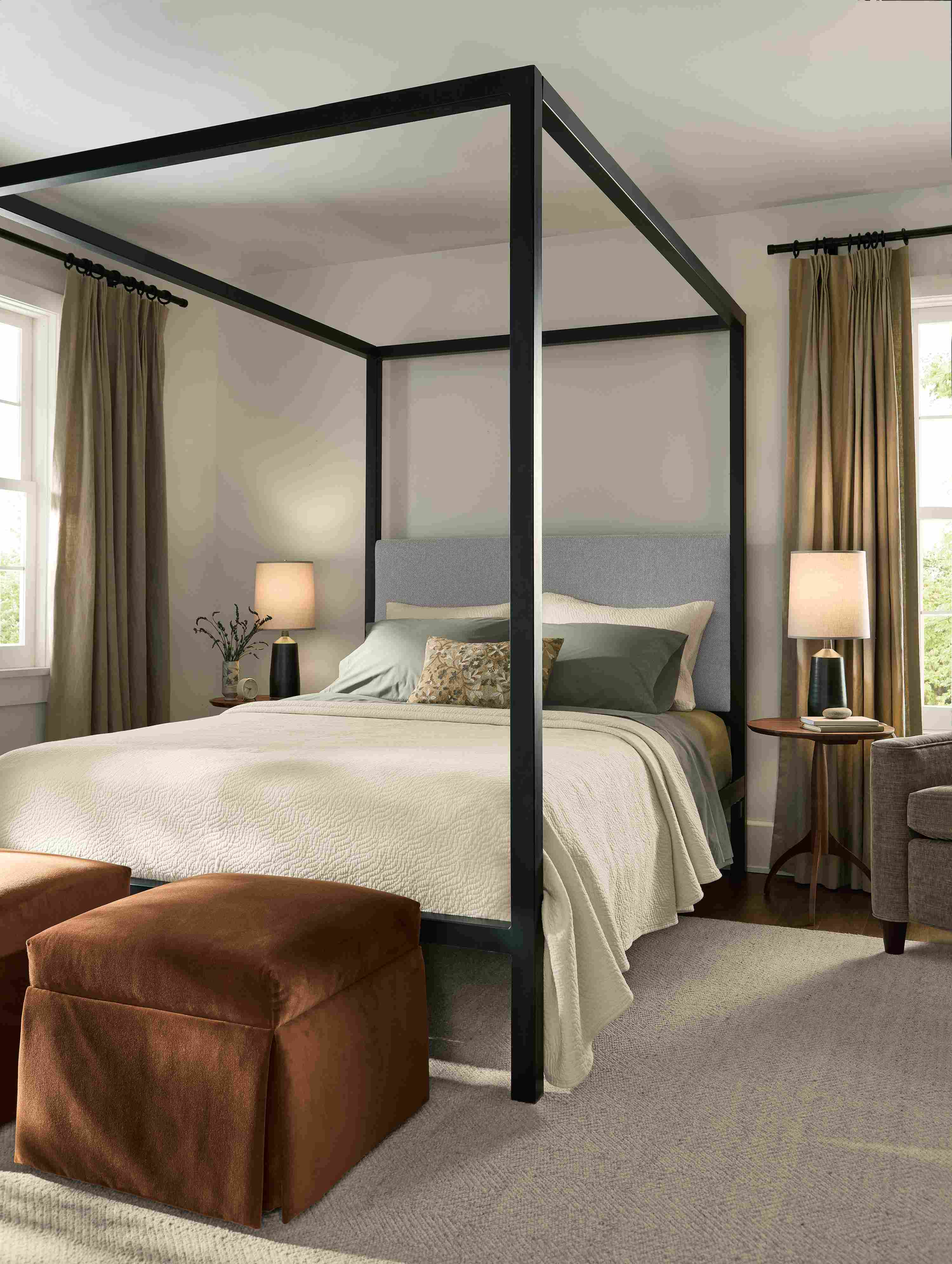 Bedroom with Architecture queen bed in Derry Cement,  and 2 Esther ottomans in Redding Nutmeg.
