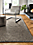 Detail of Arden low loop rug in Putty in living room.