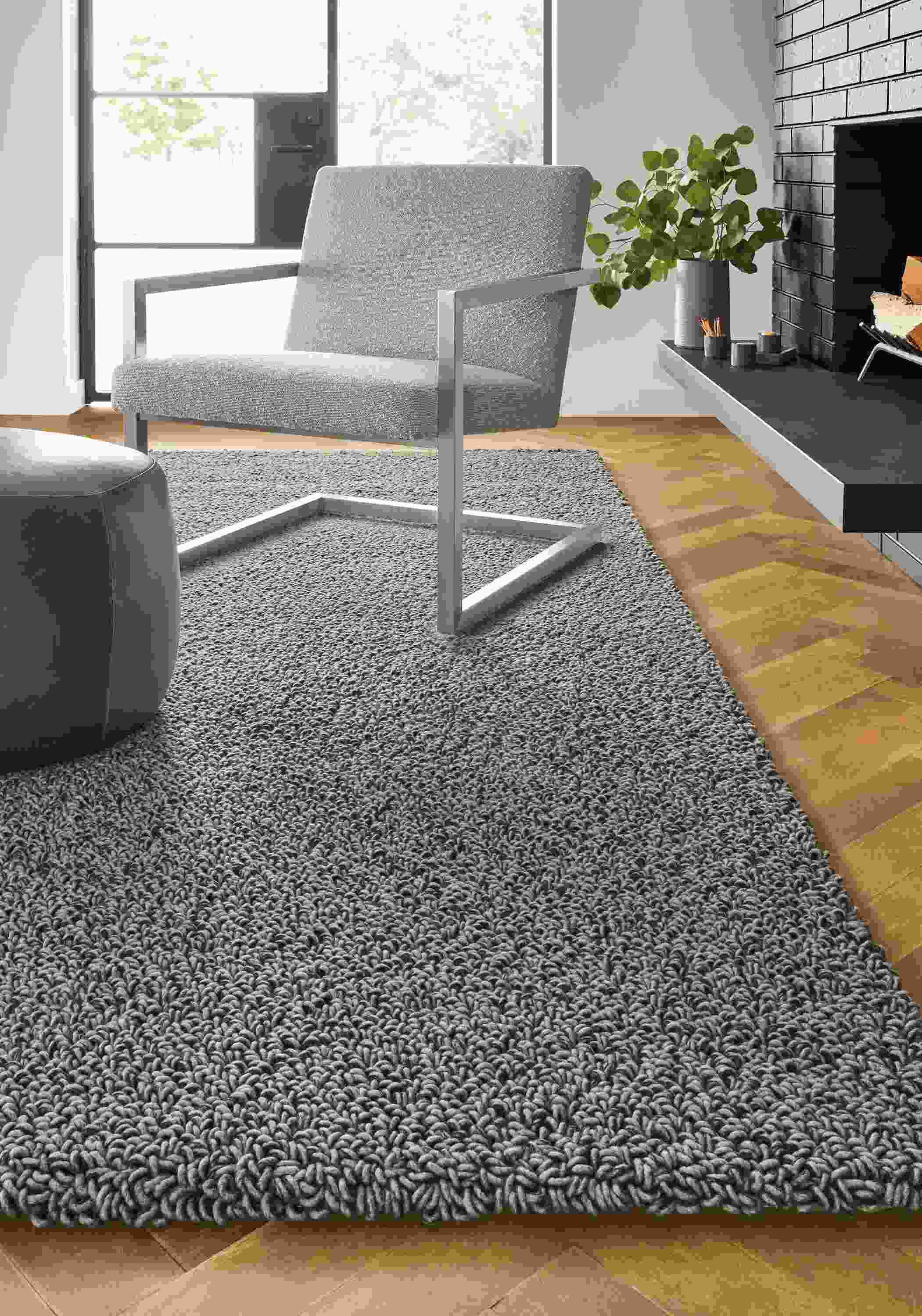 Detail of Arden high loop rug in Putty in living room.