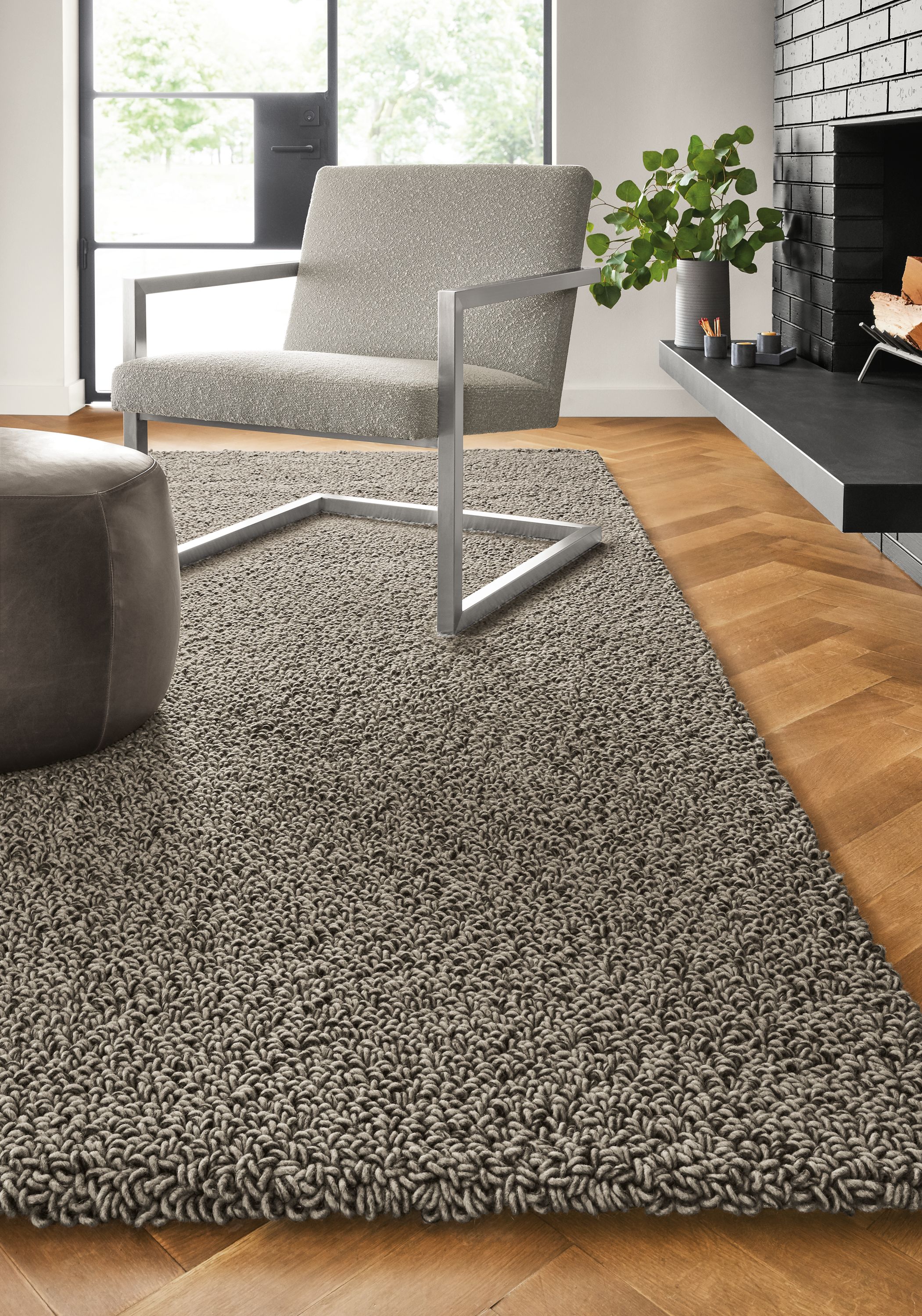 Detail of Arden high loop rug in Putty in living room.