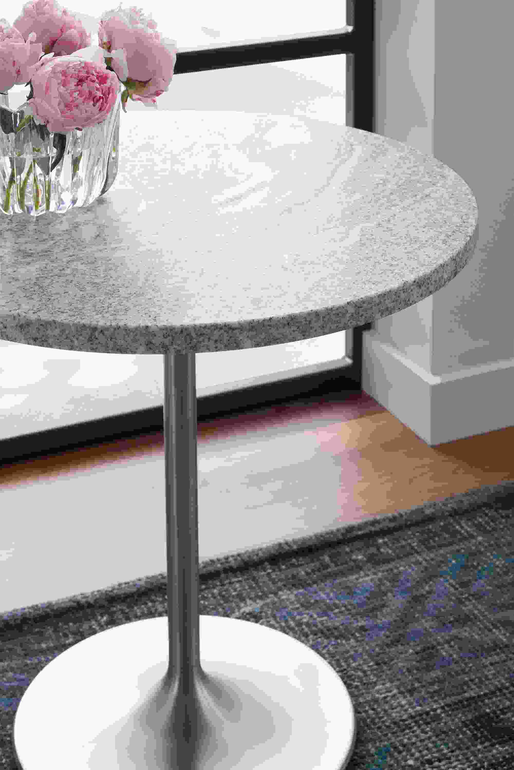 Aria 22-Round End Table with Amira Rug in Indigo.