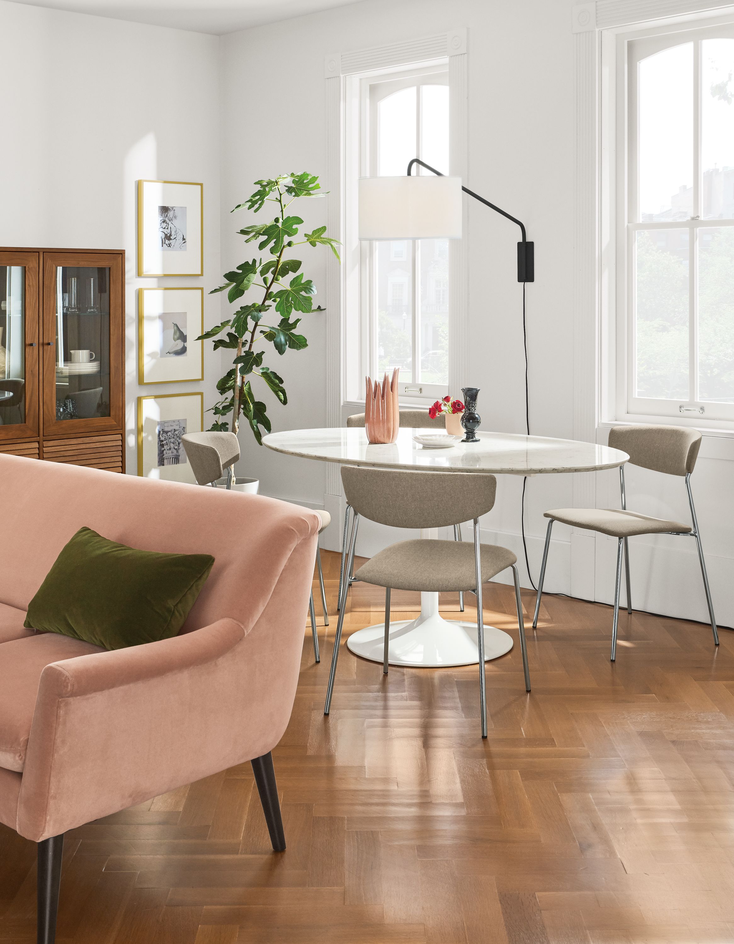 Detail of Aria 60-wide oval table in white with Wolfgang side chairs.