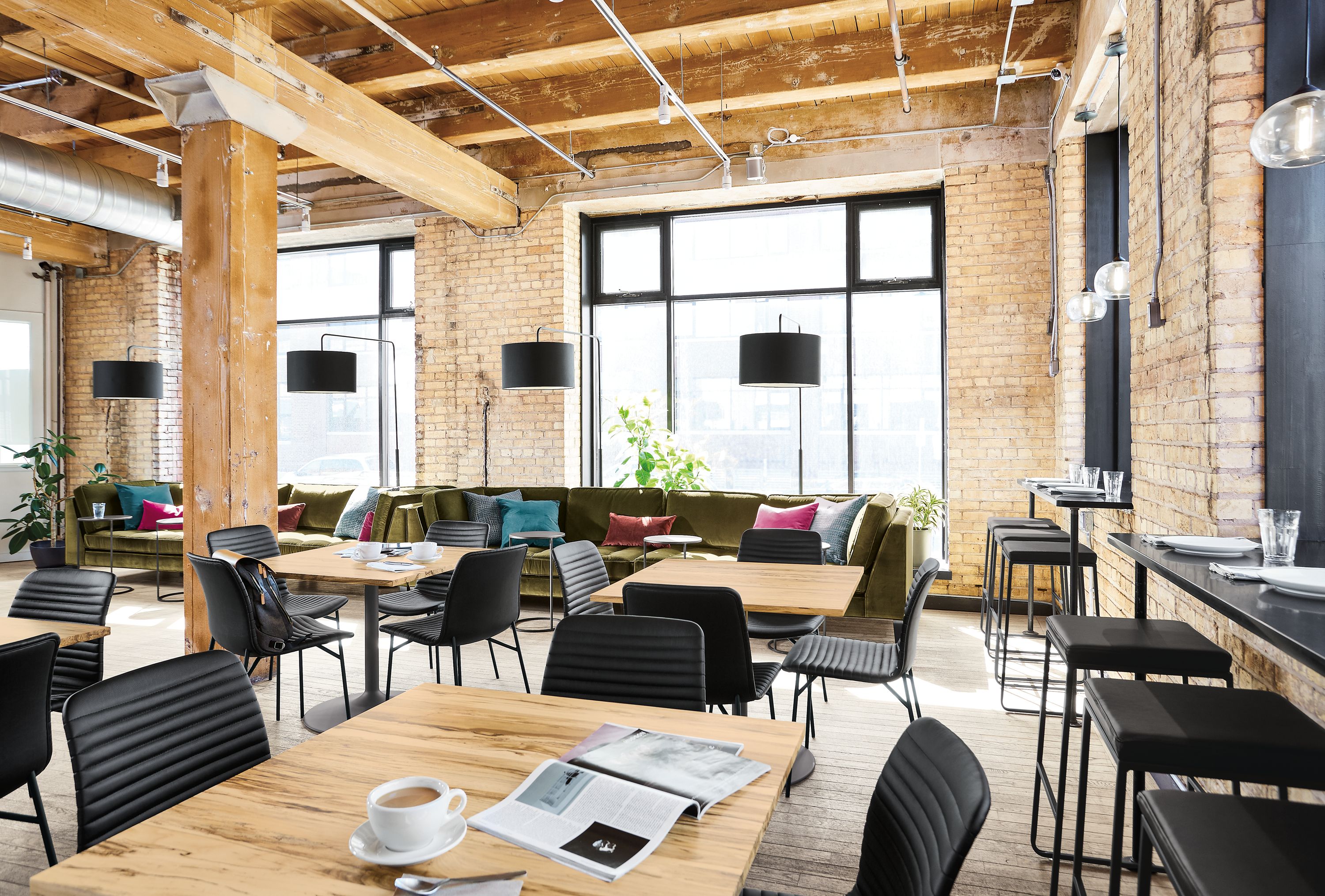 Detail of Aria table with spalted sugarberry top in cafe setting.