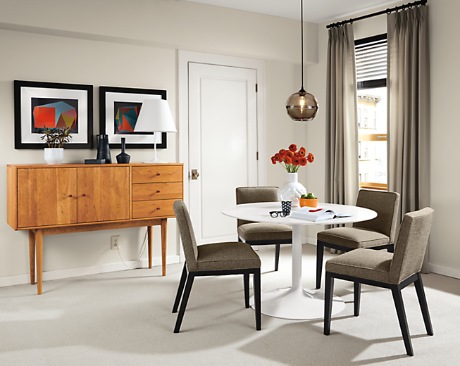 Aria white round table with four Ansel chairs.