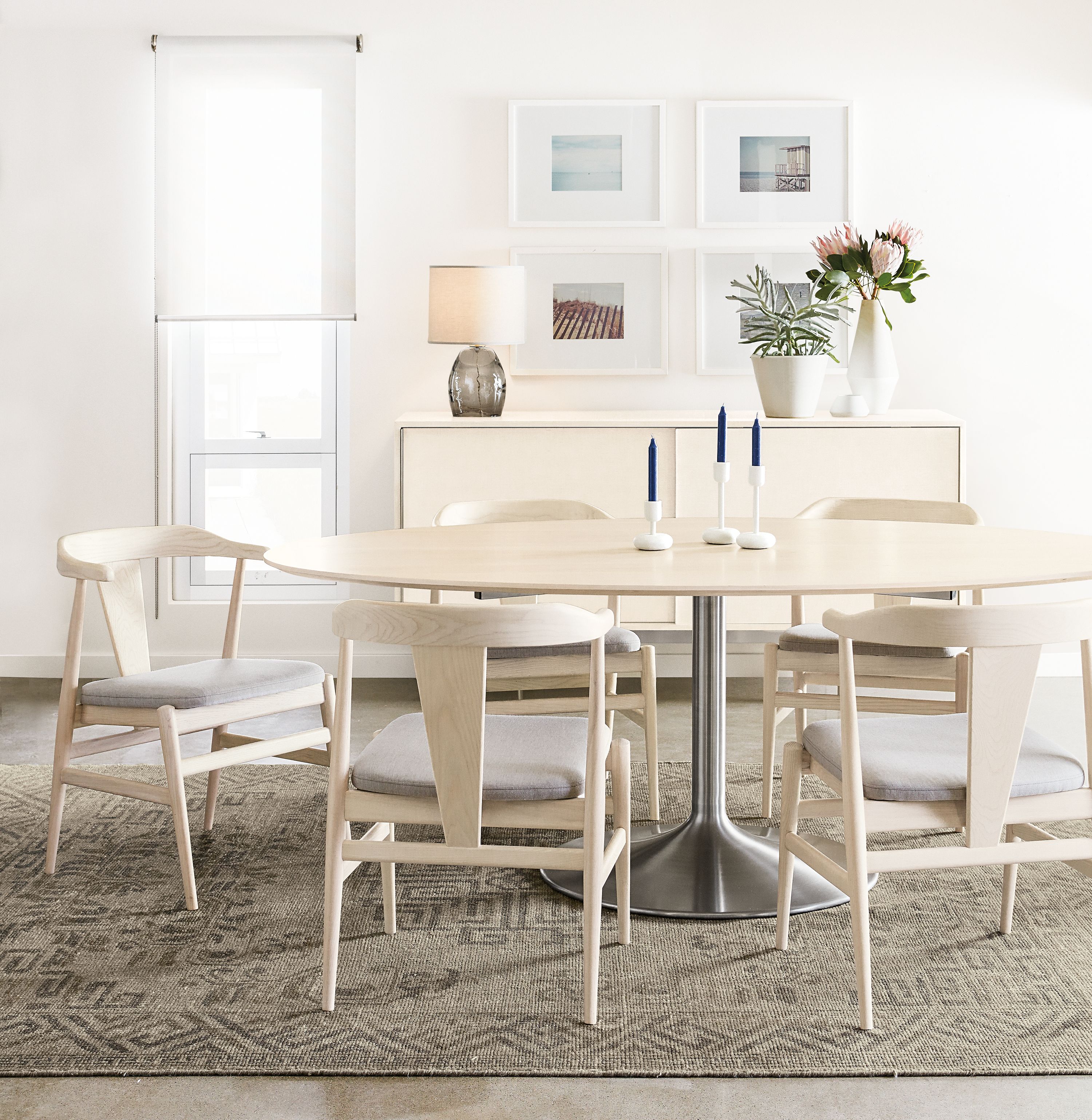 Detail of Aria Oval table with Evan Chairs in sand.