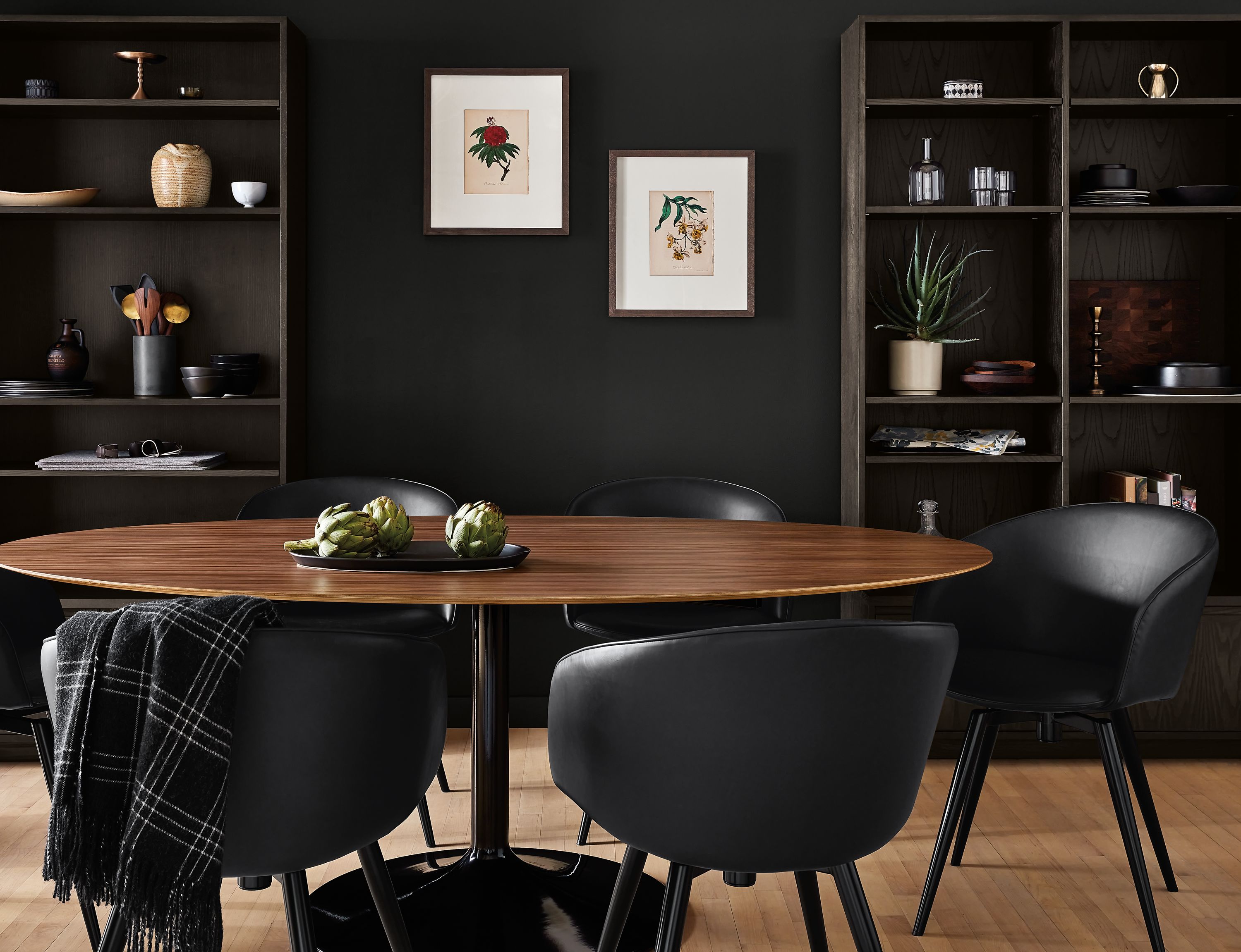 dining room with Aria oval table in onyx with walnut top and Sylvan chairs.