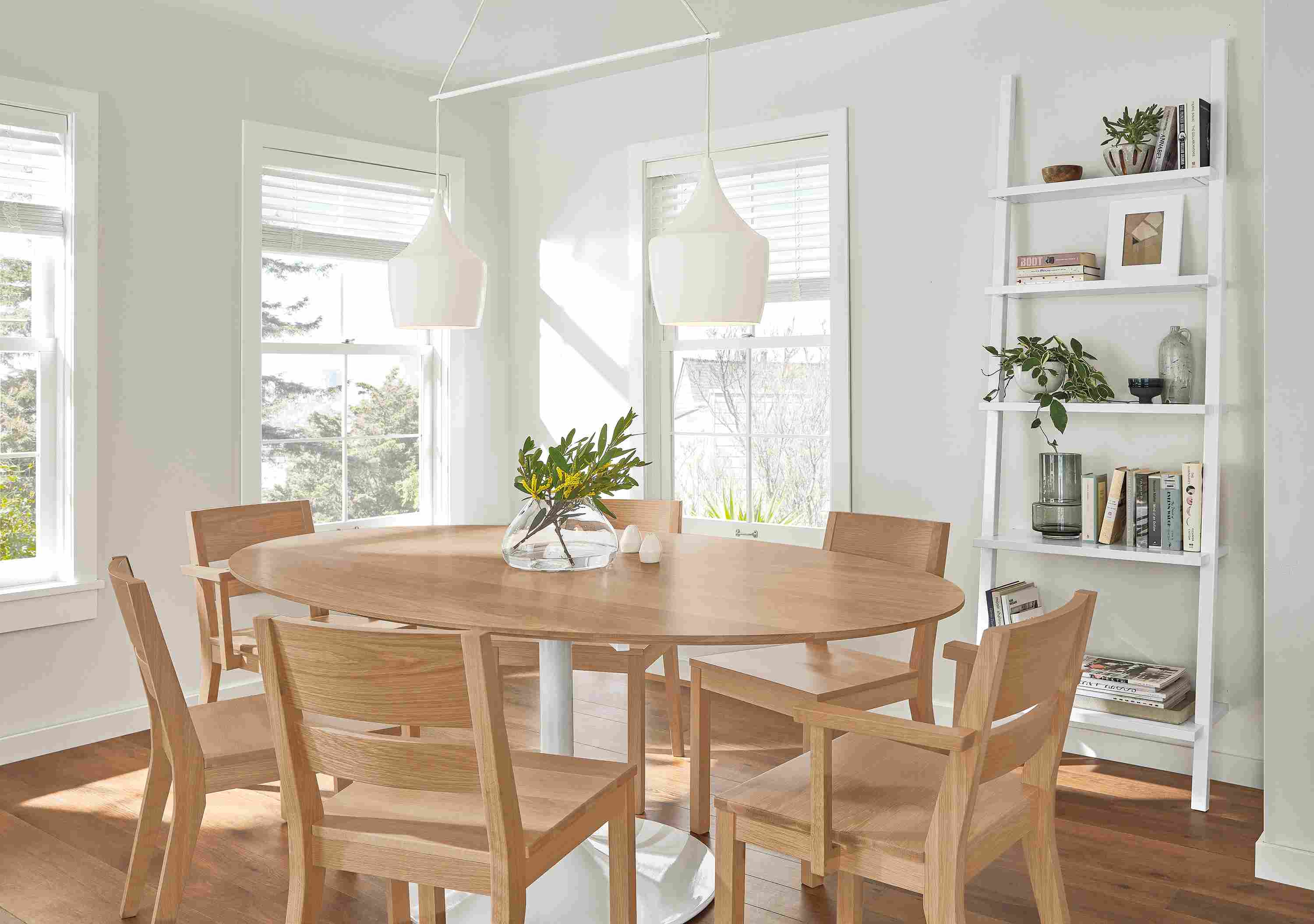 Dining room with aria oval table and afton chairs in rye on red oak.
