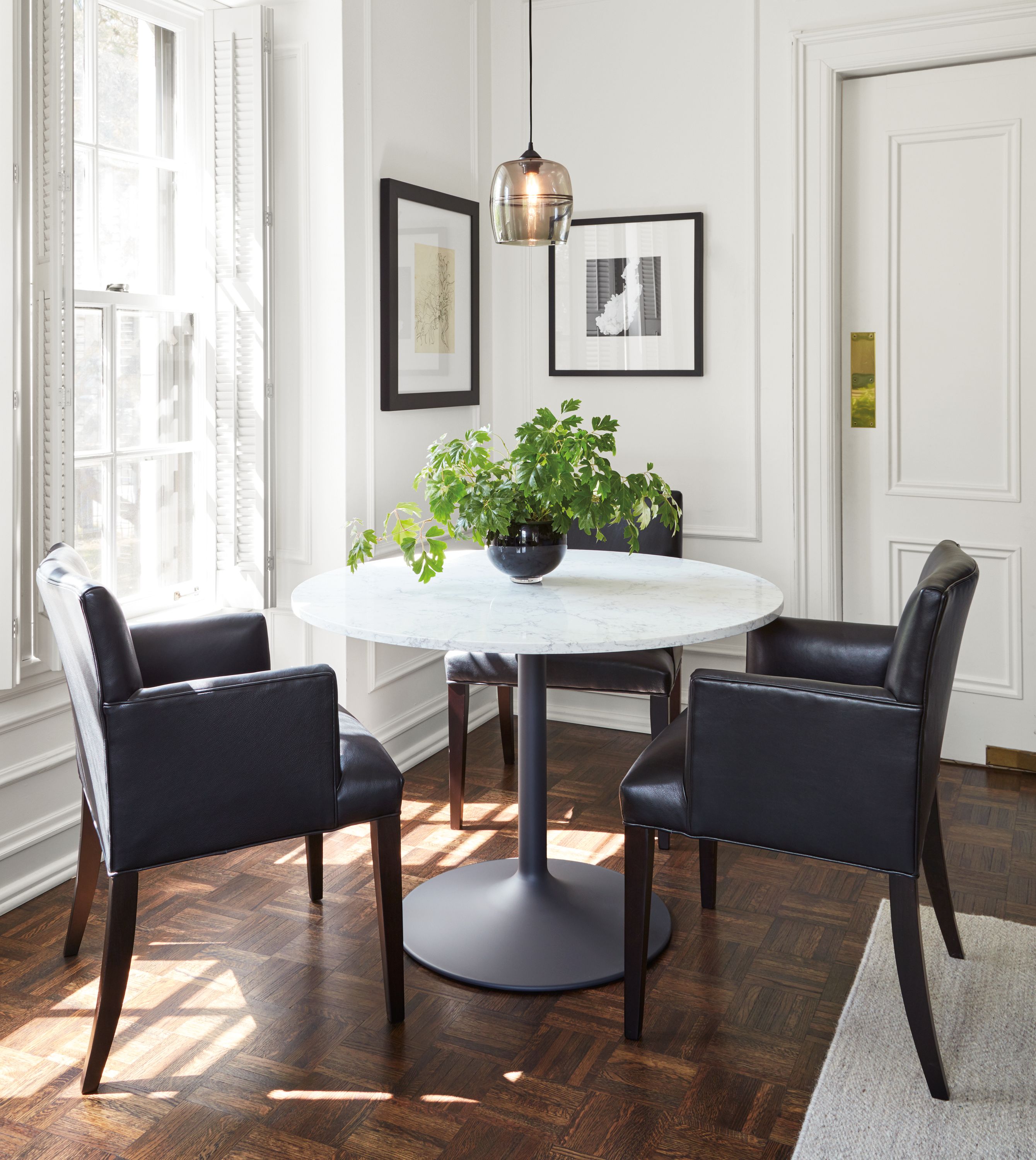 Detail of Aria round dining table in apartment.