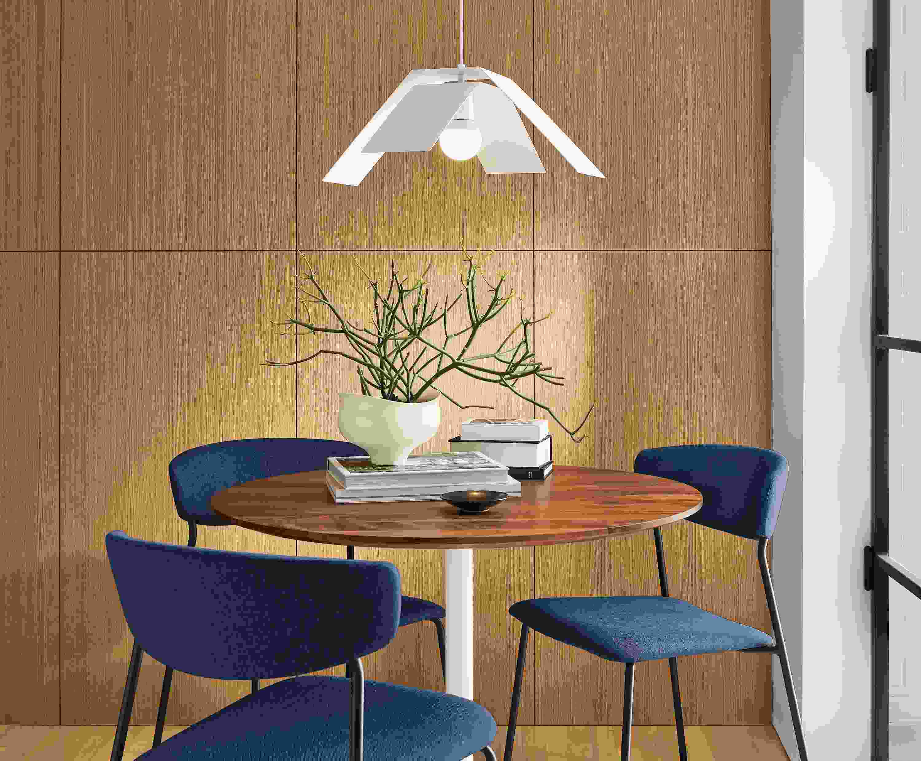 Detail of Aria 36-round table with wood top.