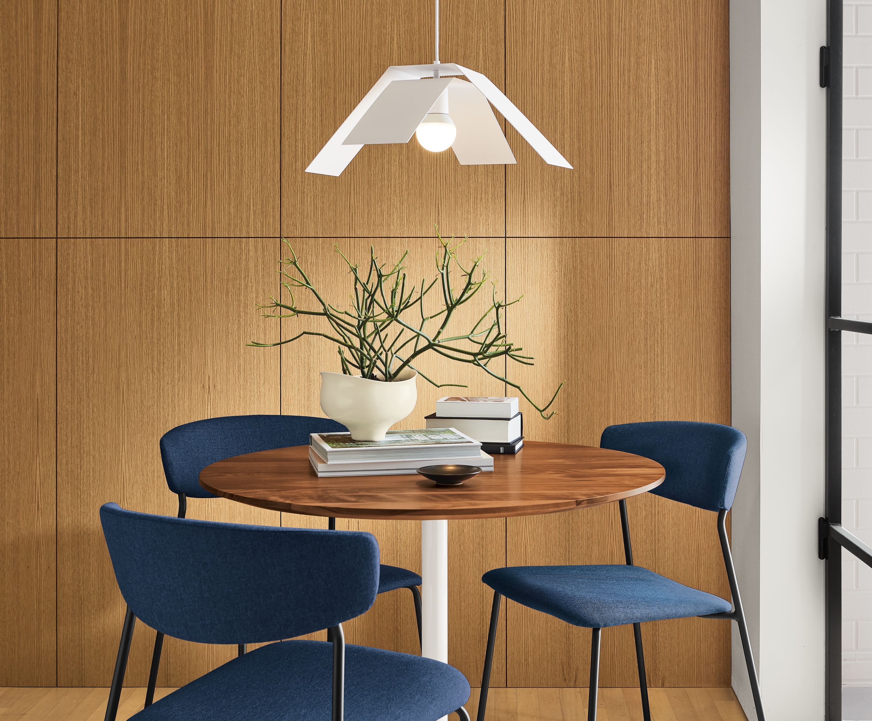 Detail of Aria 36-round table with wood top.