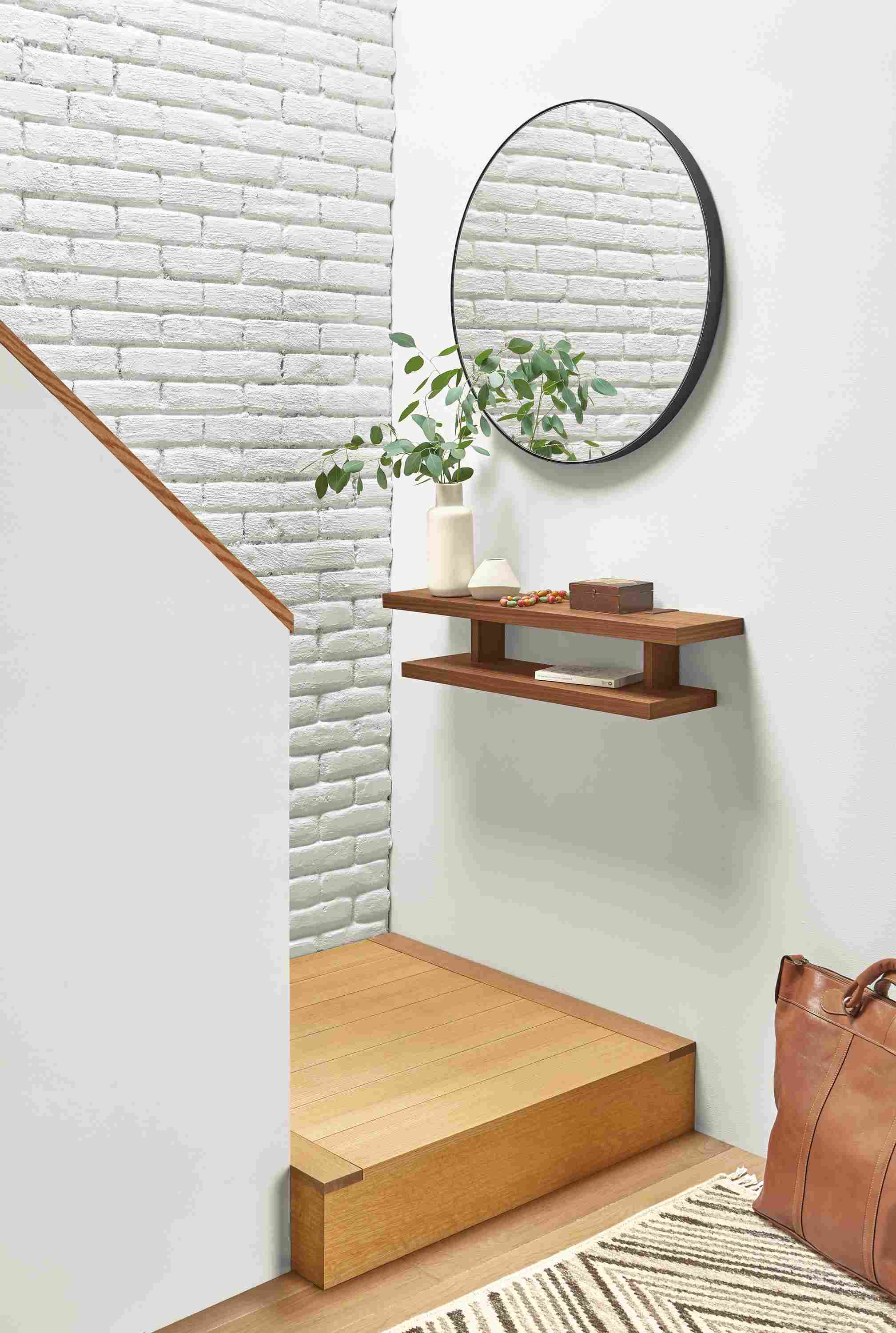 Detail of Arista wall shelf in walnut in entryway setting.