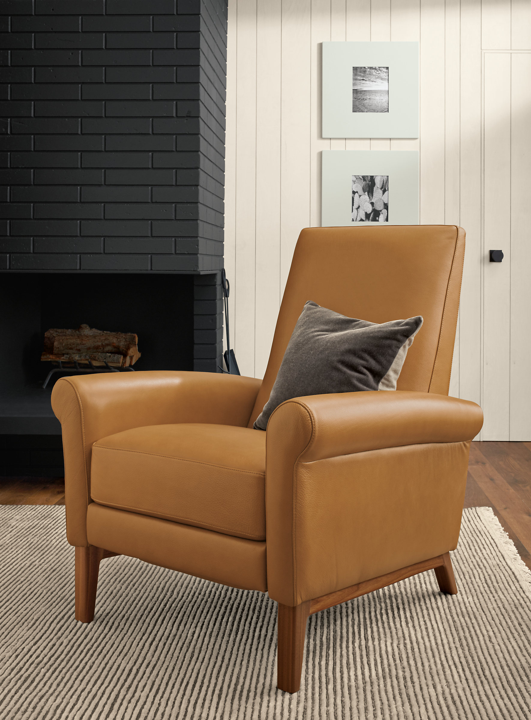 Detail of Arlo recliner in Lecco camel leather with walnut base.