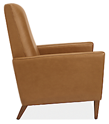Side view of Arlo thin-arm recliner in Lecco leather with walnut legs.