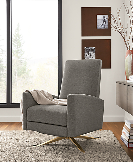 Detail of Arlo recliner in Sumner graphite fabric and steel swivel base in living room setting.