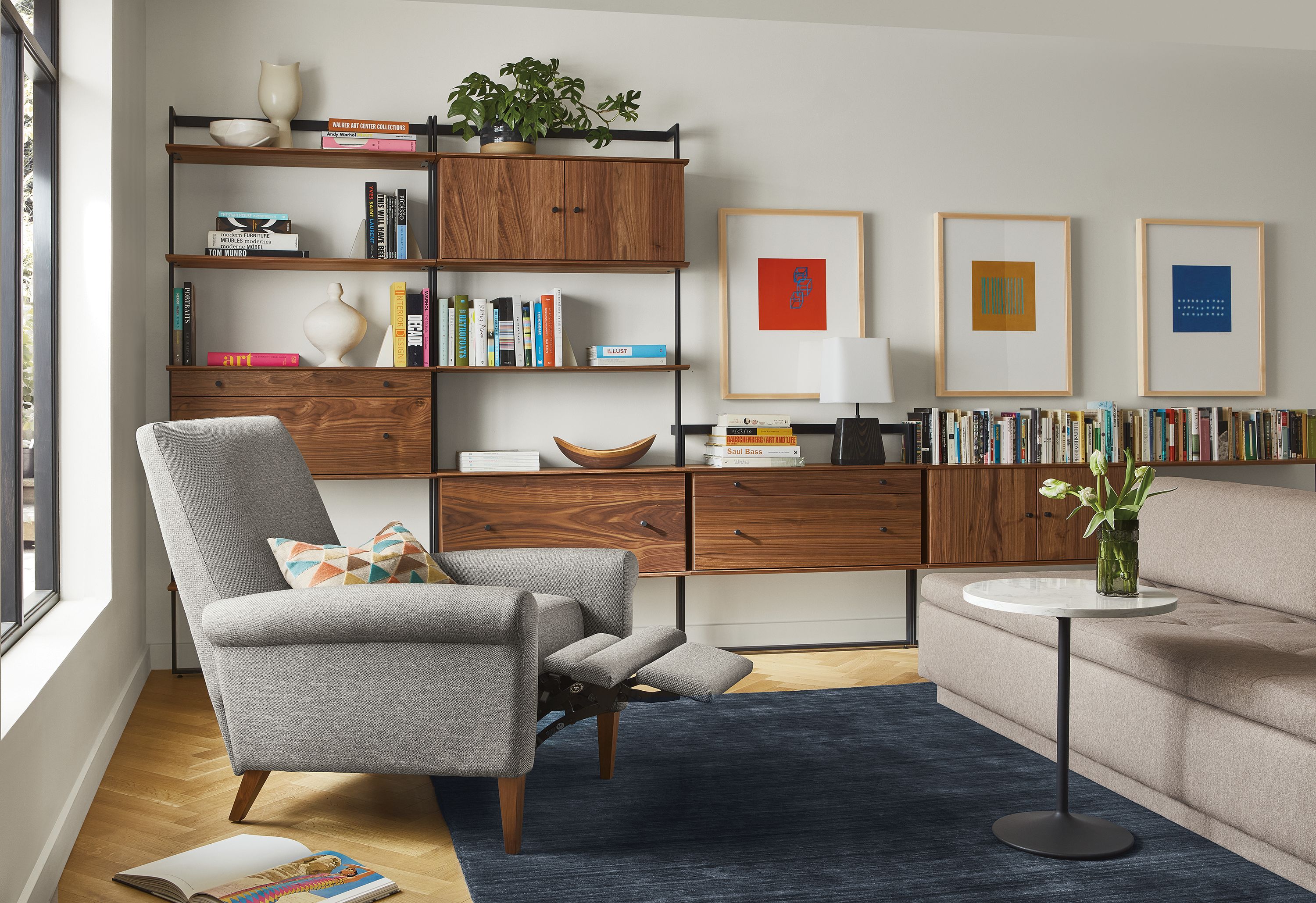 Living room with Arlo recliner extended, Beam bookcase wall unit, Miranda sectional.