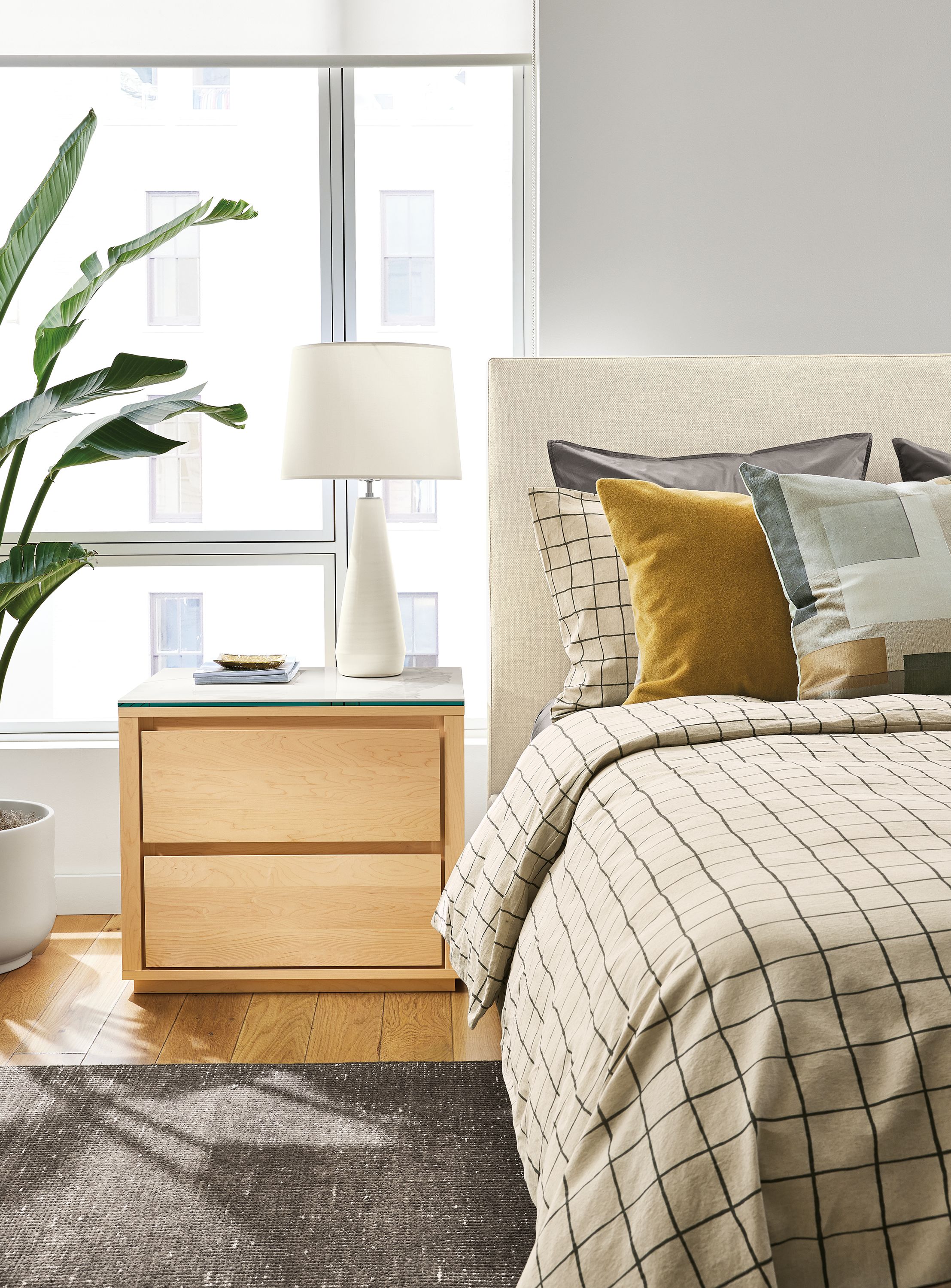 Bedroom with Arro 26-wide two-drawer nightstand in maple and marbled white ceramic and Wyatt bed in Sumner Ivory.