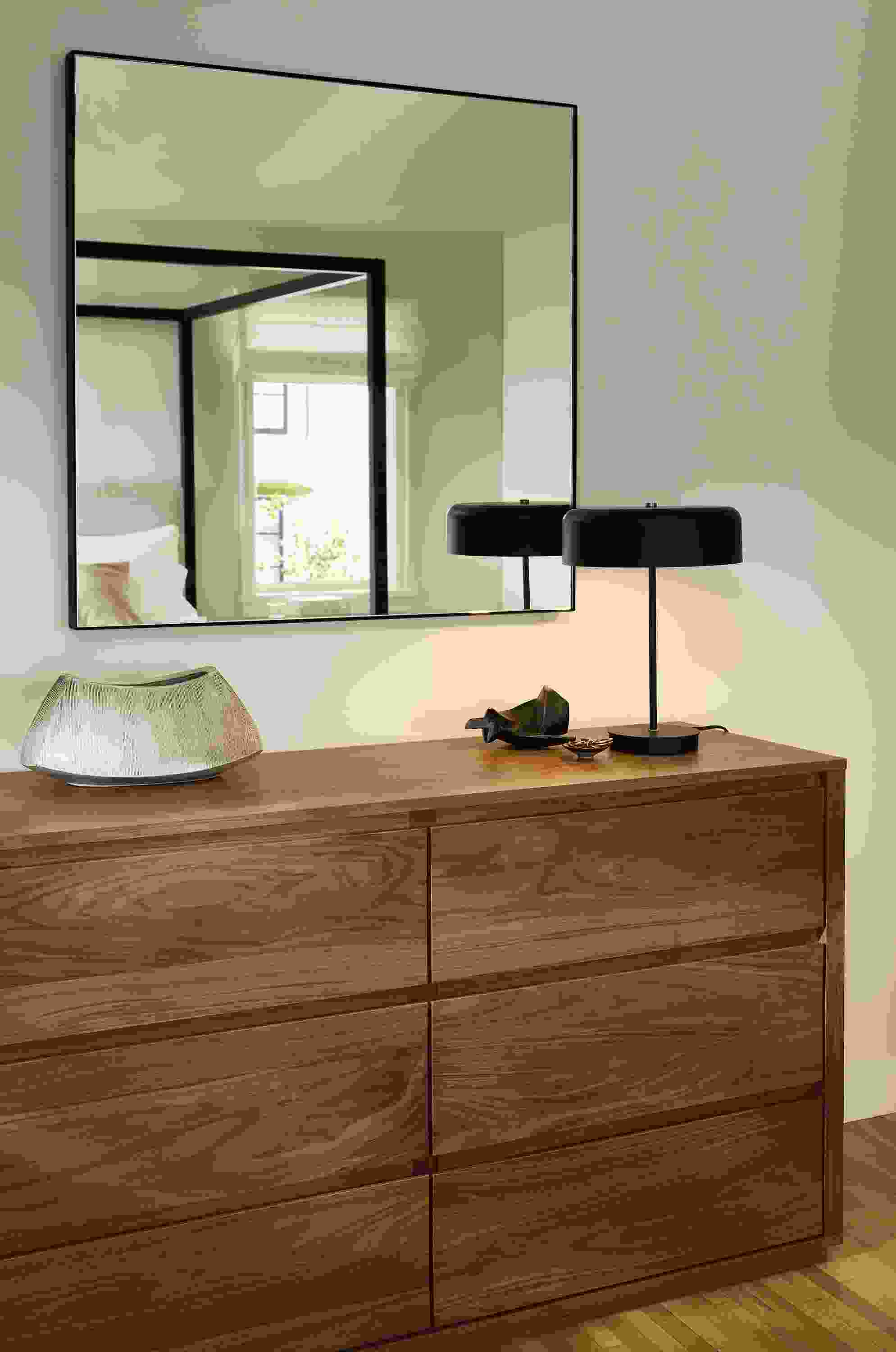 Bedroom with detail of Arro 6-drawer dresser in walnut and infiinity 36-square wall mirror in graphite.