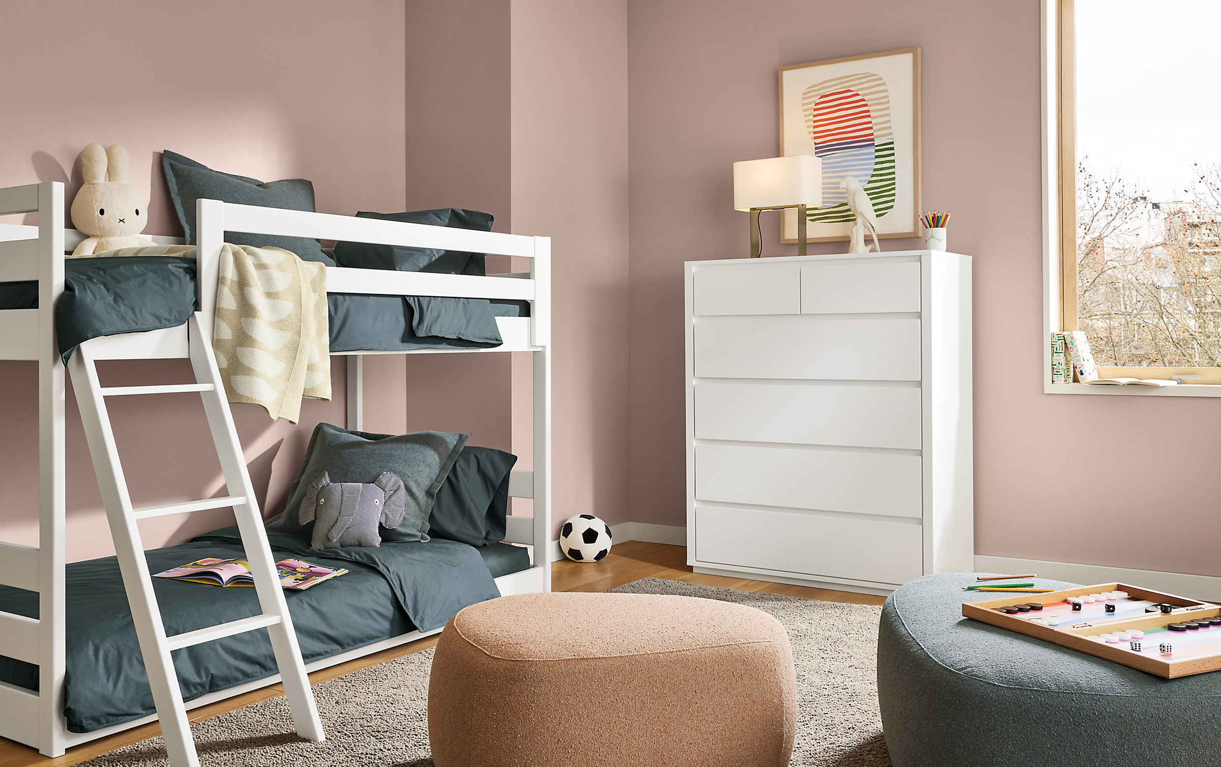 Child's bedroom with Arrow six-drawer dresser in white and Waverly twin over twin low bunk bed in white.