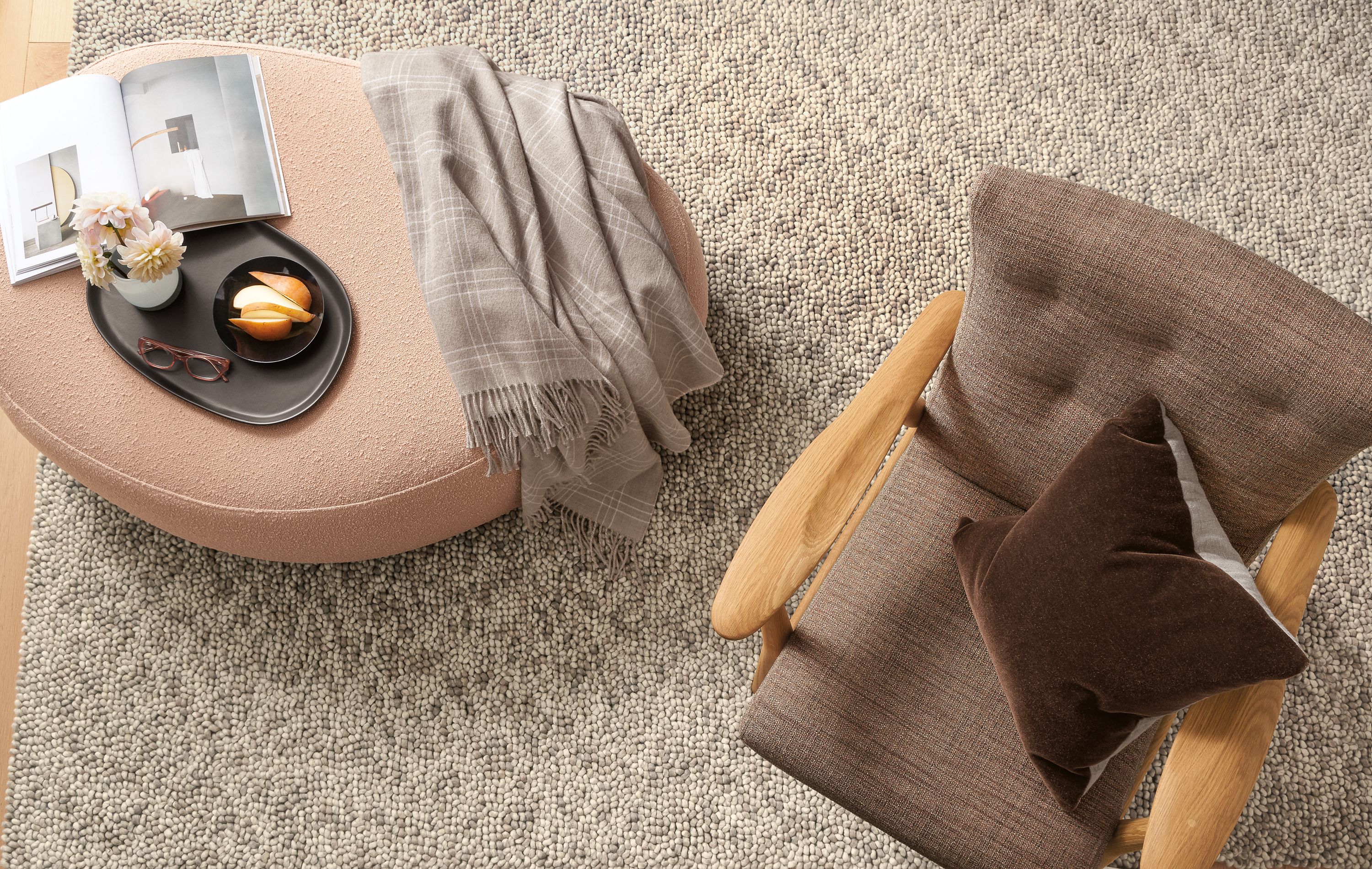 Detail of Asher ottoman in Declan Blush fabric beside Jonas chair.