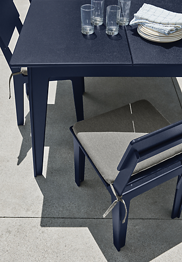 Closeup detail of Aspen outdoor table and chairs in navy.