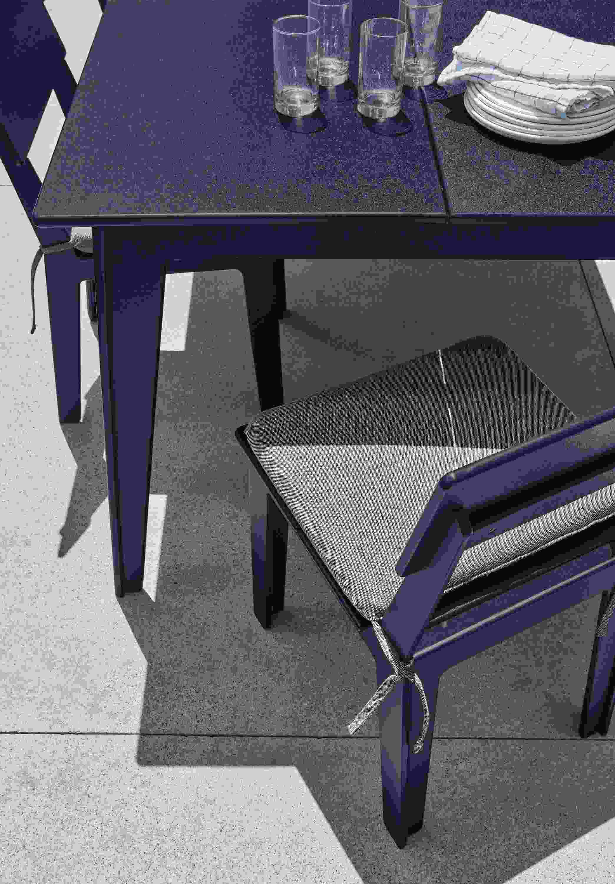 Closeup detail of Aspen outdoor table and chairs in navy.