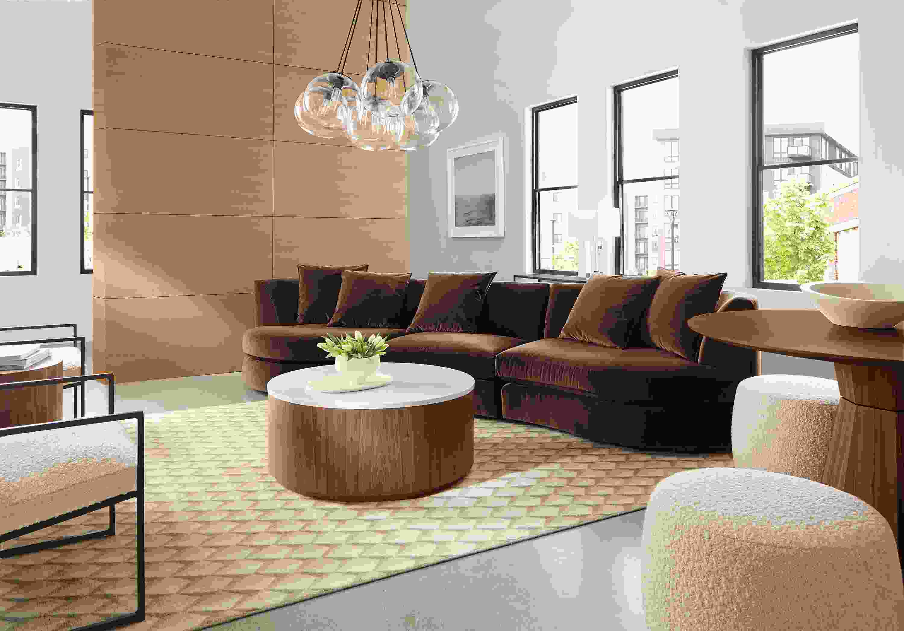 Living room with Astaire three piece sofa in Redding Espresso and Liam coffee table in walnut and marbled white quartz.