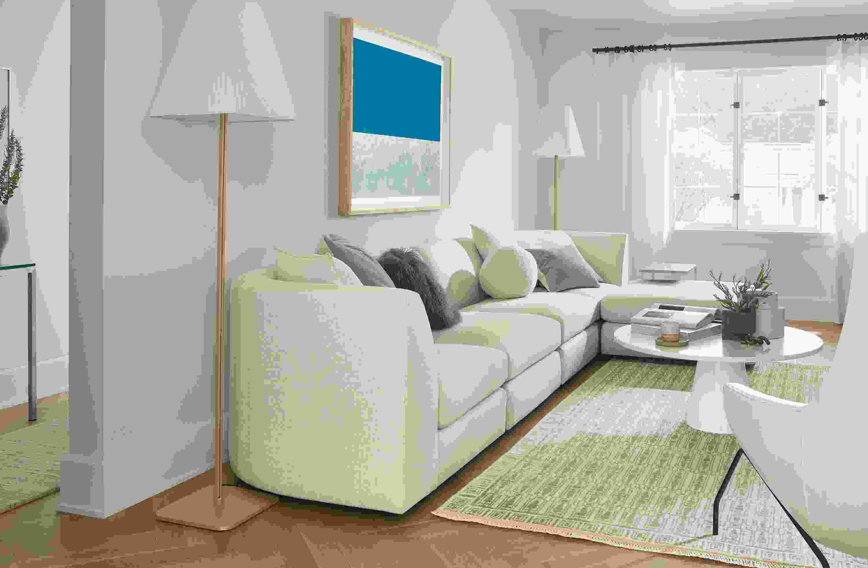 Astaire 138-wide Five-Piece Modular Sofa with Ottoman in Sumner Fabric with Tulum 6'x9' Rug in Taupe.