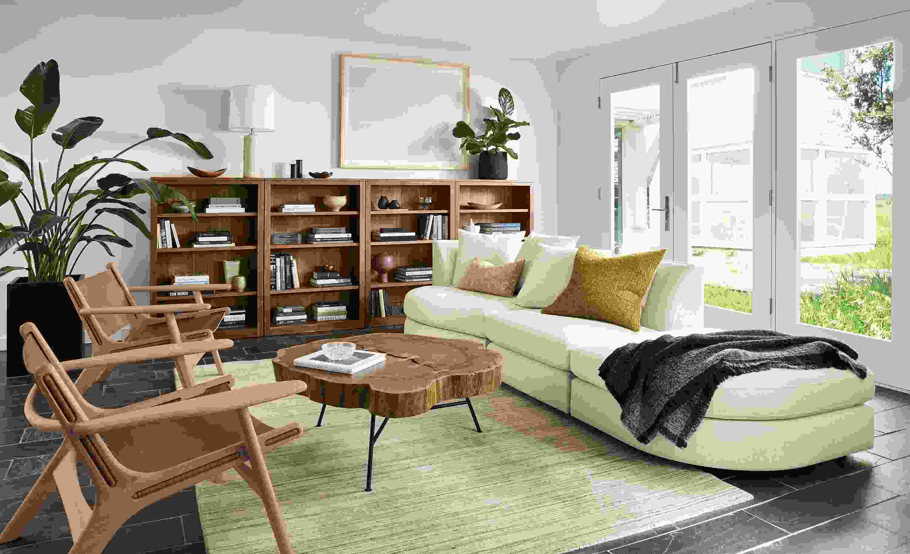 Living room with Astaire sofa and chair and ottoman in sumner ivory and 2 Lars lounge chairs in Sellare Cognac.