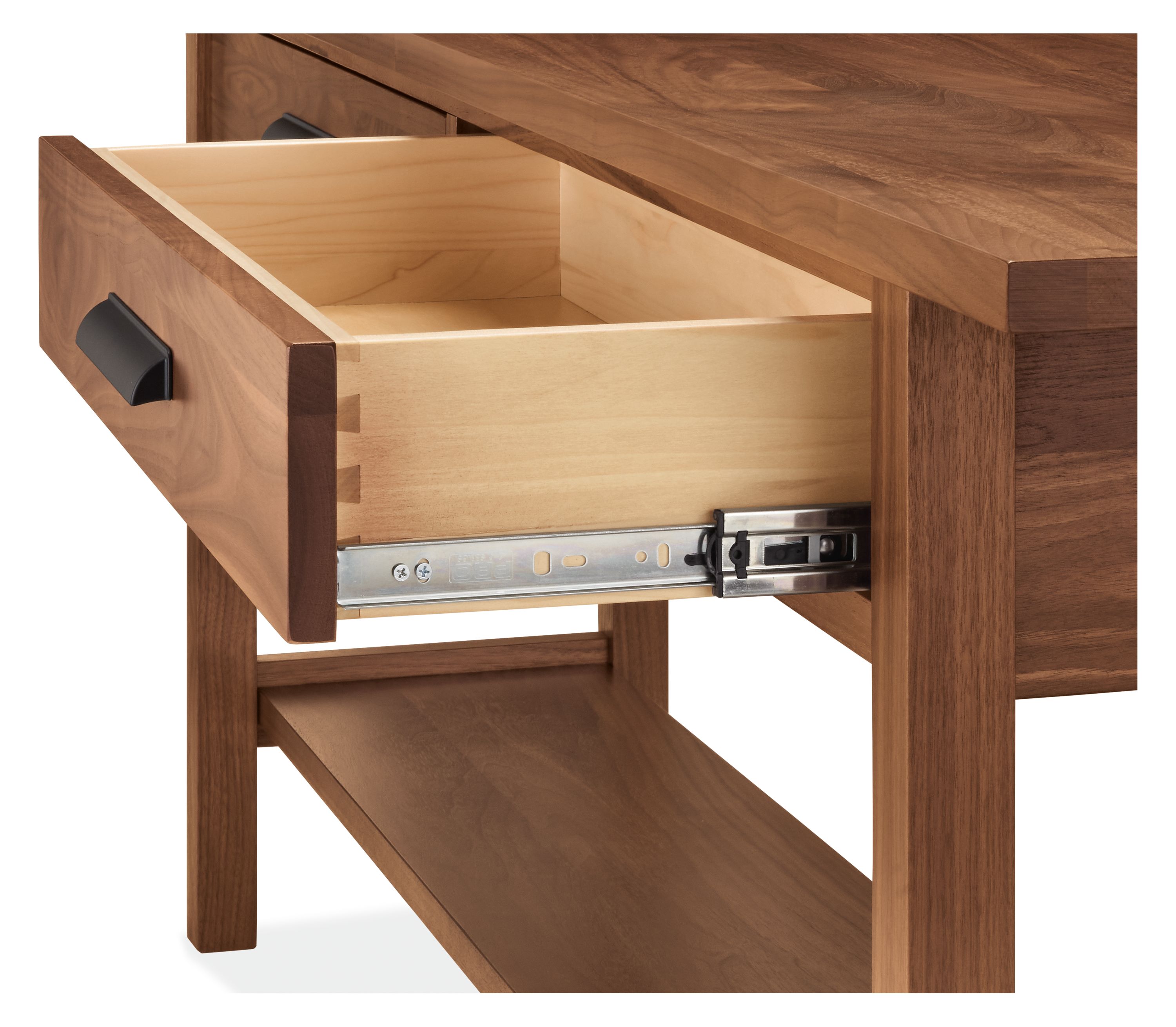 Detail of open drawer and slide mechanism on an Atherton 78-wide console table in walnut with graphite pulls.