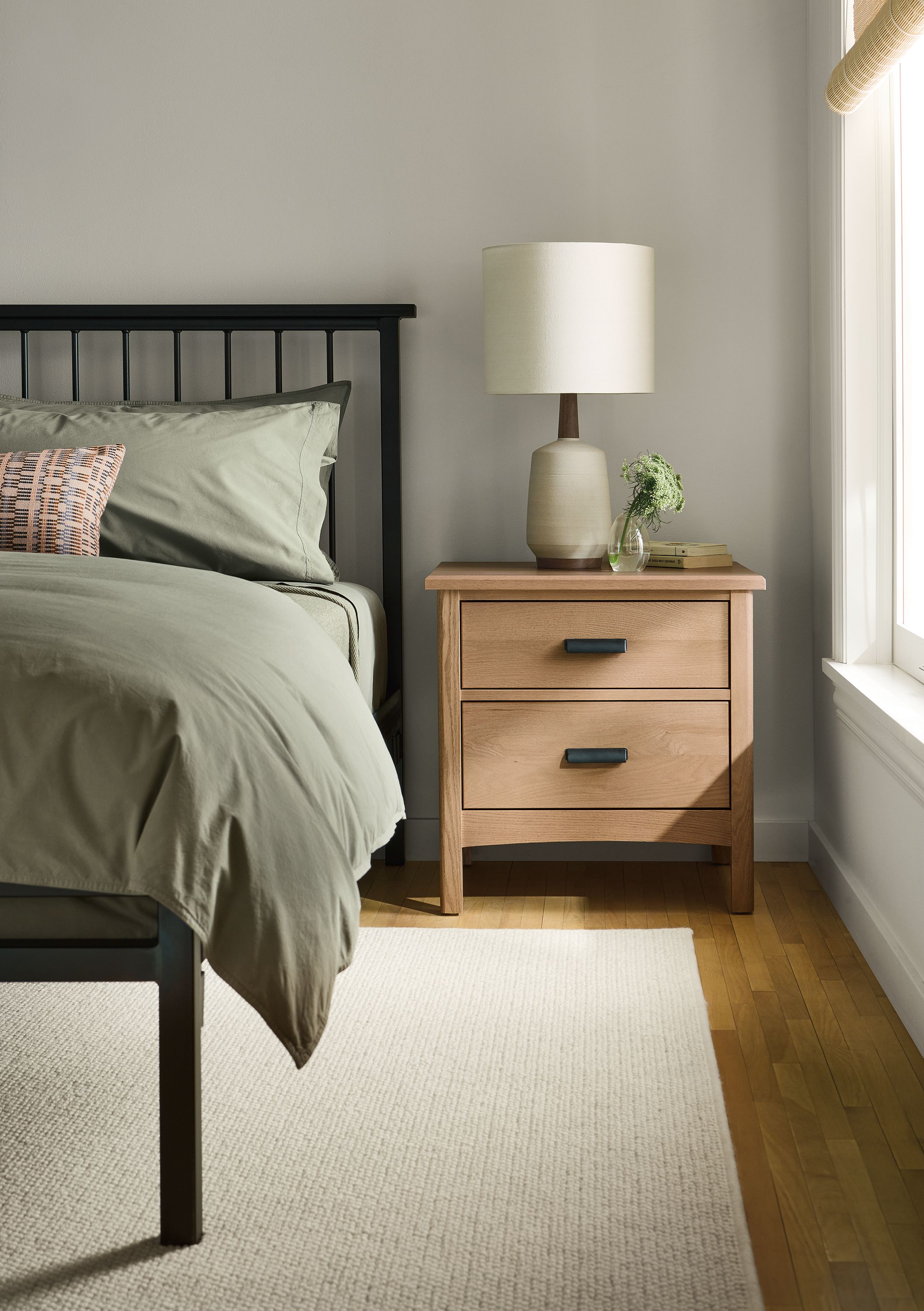 Bedroom with Atherton 2-drawer nightstand in rye on red oak and Mackintosh king bed in natural steel.
