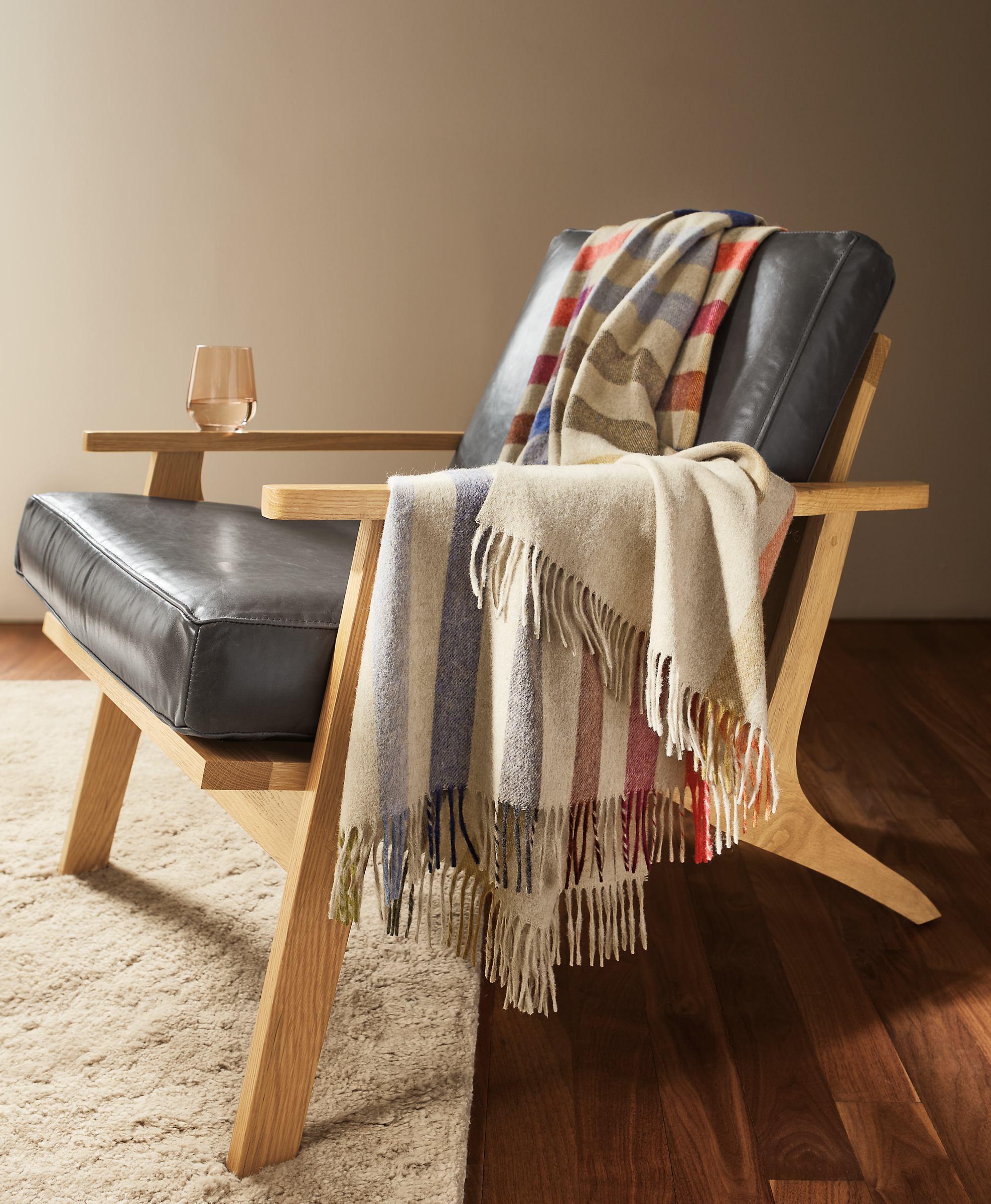 detail of audrey throw blanket draped on sanna chair.
